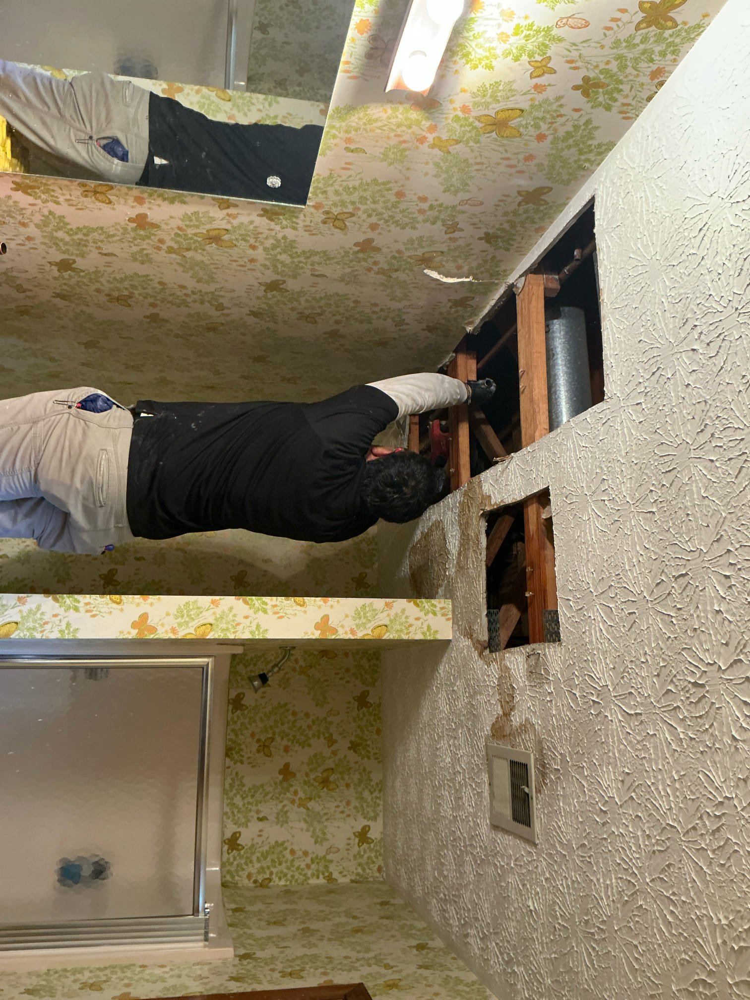 Client called us out today due to a leak in the main floor bathroom ceiling that has caused a good bit of water damage to the home. The water has also traveled to the laundry room next to it and had started puddling. Home has copper water pipes that are about 40+ yrs old. We cut out sections of the Sheetrock ceiling to expose the leaking copper pipe above. It was the cold side that has 5 separate locations that were corroded and leaking in about a 6-8’ section of pipe. We removed that section of copper and repaired with new 3/4” pex a water pipe and findings. Turned water back on and tested. No visible leaks at this time. Checked water pressure and it was perfect at 55 psi, safe range is 50-79 psi. It seems the builder of home years ago used a bent over nail to secure the copper pipe to the wood, which would more than likely be the cause of this oxidation and leaks on that section of pipe. Advised client to be highly vigilant with paying attention for leaks, as I think this is only the Client called us out today due to a leak in the main floor bathroom ceiling that has caused a good bit of water damage to the home. The water has also traveled to the laundry room next to it and had started puddling. Home has copper water pipes that are about 40+ yrs old. We cut out sections of the Sheetrock ceiling to expose the leaking copper pipe above. It was the cold side that has 5 separate locations that were corroded and leaking in about a 6-8’ section of pipe. We removed that section of copper and repaired with new 3/4” pex a water pipe and findings. Turned water back on and tested. No visible leaks at this time. Checked water pressure and it was perfect at 55 psi, safe range is 50-79 psi. It seems the builder of home years ago used a bent over nail to secure the copper pipe to the wood, which would more than likely be the cause of this oxidation and leaks on that section of pipe. Advised client to be highly vigilant with paying attention for leaks, as I think this is only the