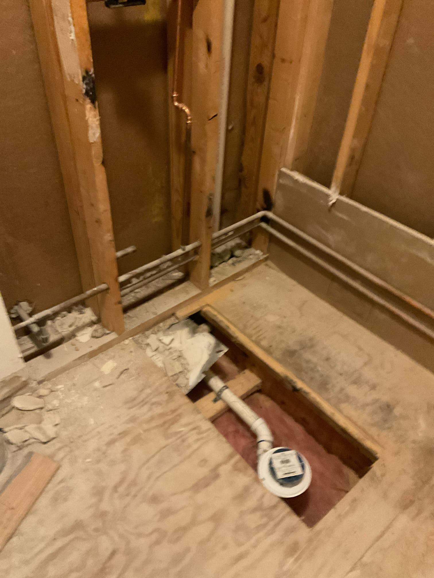 Convert tub drain for tile shower , cut subfloor open to move the drain     Convert tub drain for tile shower , cut subfloor open to move the drain