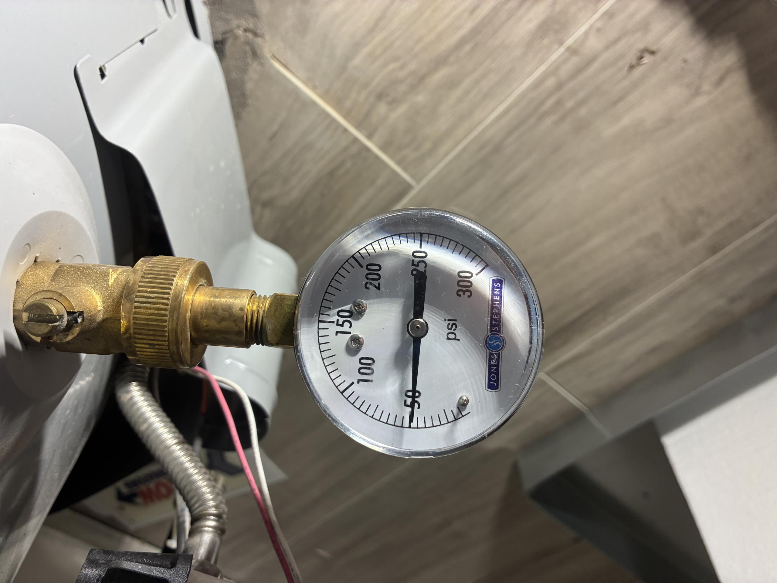 Call for leak in yard.

Arrived and met with Tyler. 

Leak is very evident at side of road, approximately 20-30 feet away from water meter.

Checked both water meter boxes, and the irrigation box. Both meters show no flow going through them. I believe this leak is in the county main line, and have advised Tyler to contact Atlanta water service by calling 311.

I checked the pressure on the house and found it to be 50psi @9am. Pressure regulating valve is manufactured in 2017, and I recommend replacing it by 2027. Water heaters are both in good condition. 

No other concerns at this time.