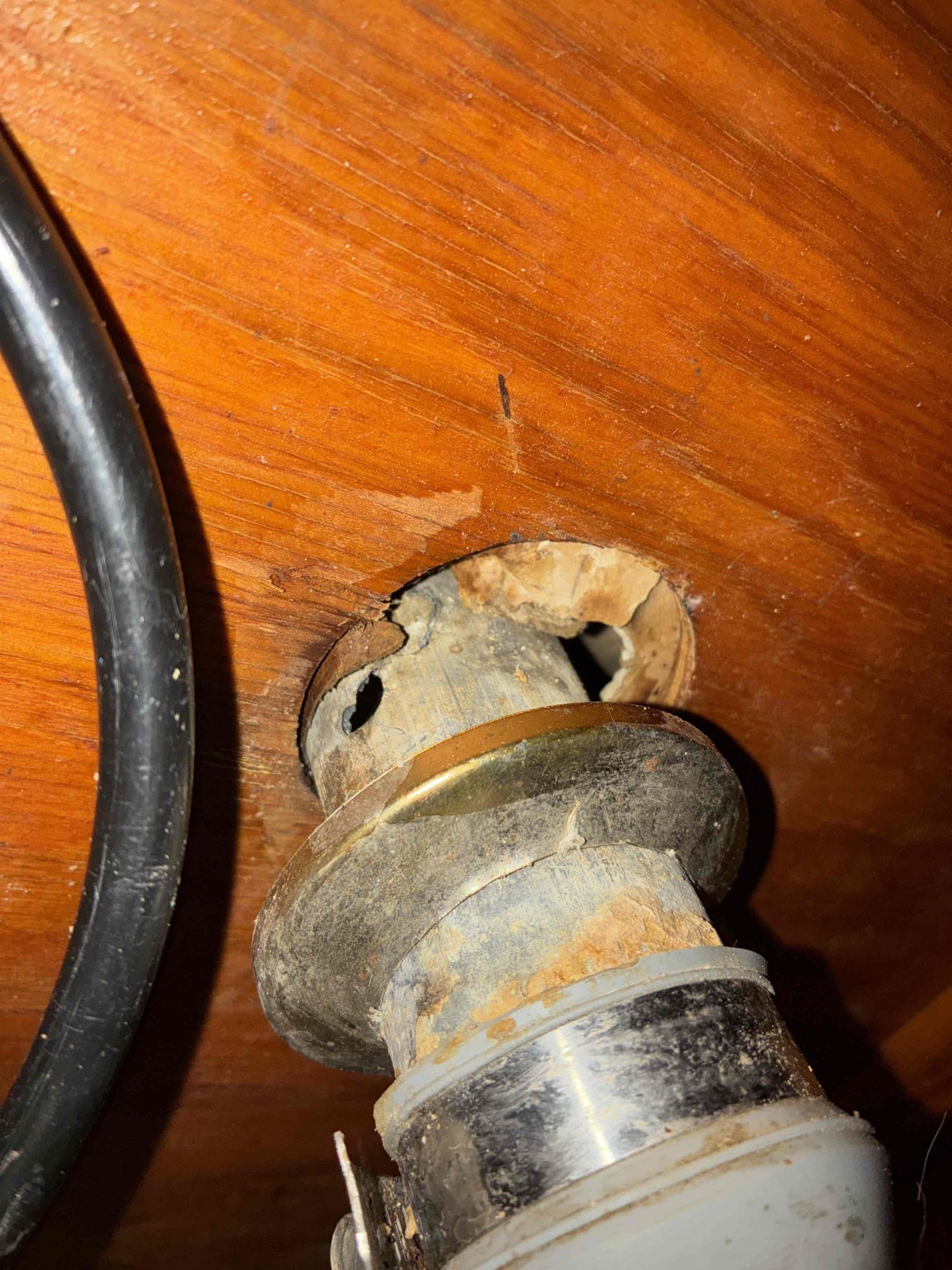 Customer had stoppage affecting drainage of kitchen sink. Removed ptrap and ran small snake 15’ to clear line. Filled sink to drain test line but noticed water coming out of topside hole in pipe behind escutcheon while draining sink. Leak only appears when large volume of water is drained. Showed customer and explained conditions. Customer wants to wait to address issues. Not responsible for any further issues involved with drain line leak. Line drains properly aside from hole in line. 