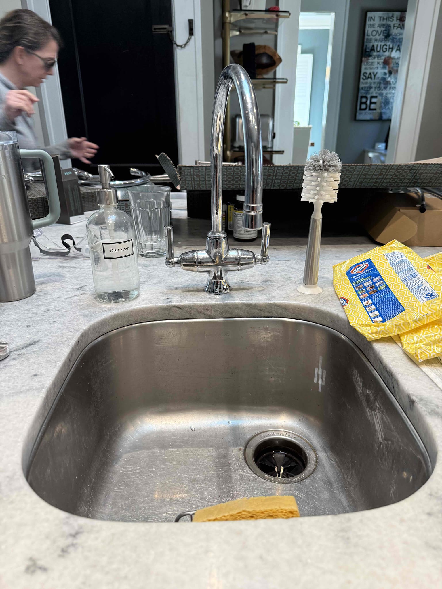 Homeowner states that they had several fixtures they wanted replaced and they supplied all of them. Upon arrival I was greeted by homeowners at door and they explained that they had two toilets two kitchen faucets and a garbage disposal replaced and they supplied all the parts. I offered them a couple of solutions and they agreed to get it everything done today. I began by shutting off the water meter and drained the home to remove both kitchen faucets. I had to cut and remove the faucet in the big sink and the island sink came out a lot easier then I removed the garbage disposal in the big sink and waited for homeowner to drill the new hole for the new faucet. I installed the island faucet and connected the supply lines also supplied by homeowners. Then I moved to the two toilets one located on hallway near kitchen and the second toilet located on right side of house hallway. I removed both toilets and cleaned the flanges and added new closet bolts as well as new wax rings and supply 
