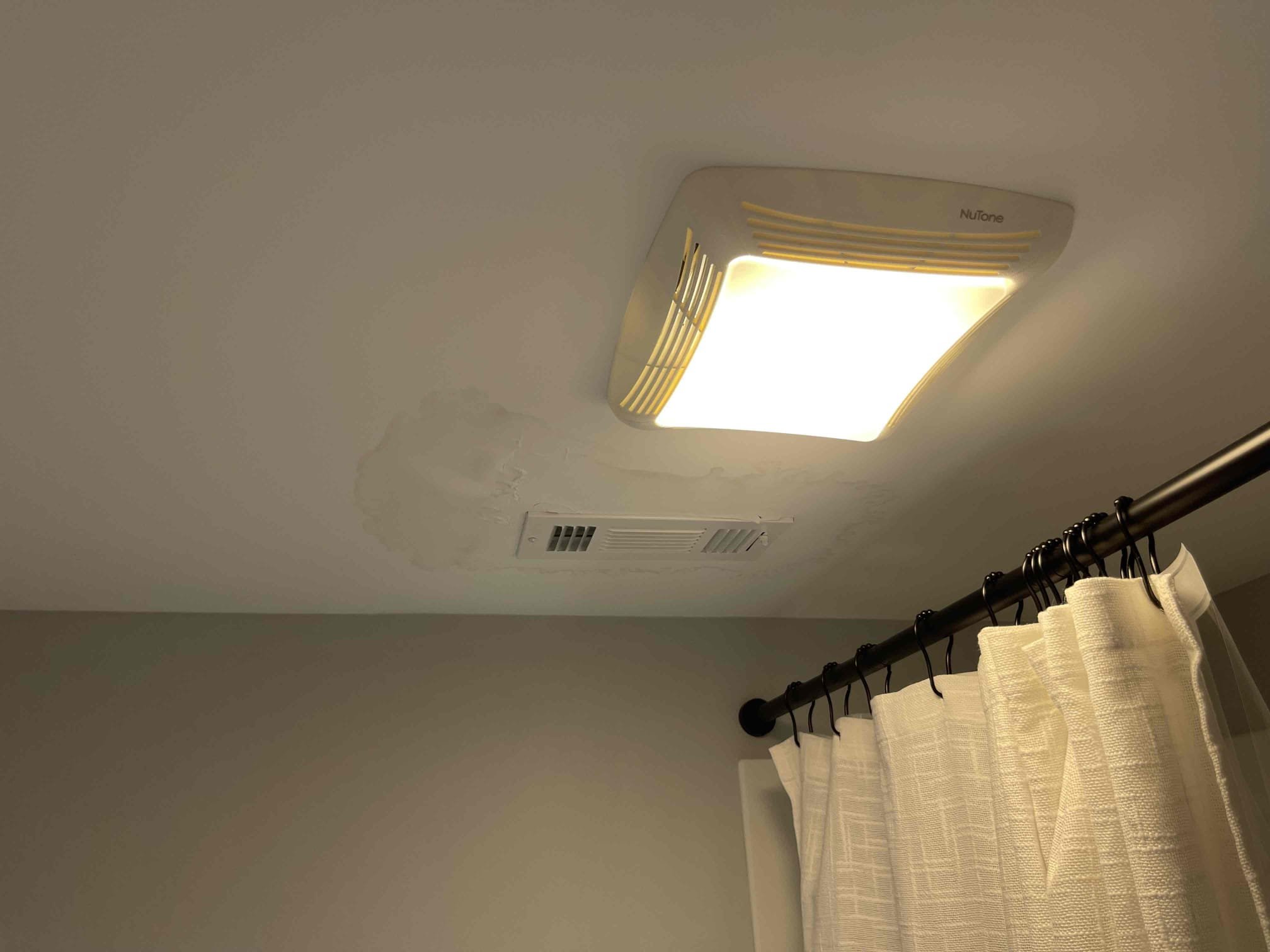 Cut open drywall. Ran water from every fixture upstairs. Were able to recreate the leak by running water down the overflow tub. Replaced overflow gasket and tested to ensure a leak free install. 