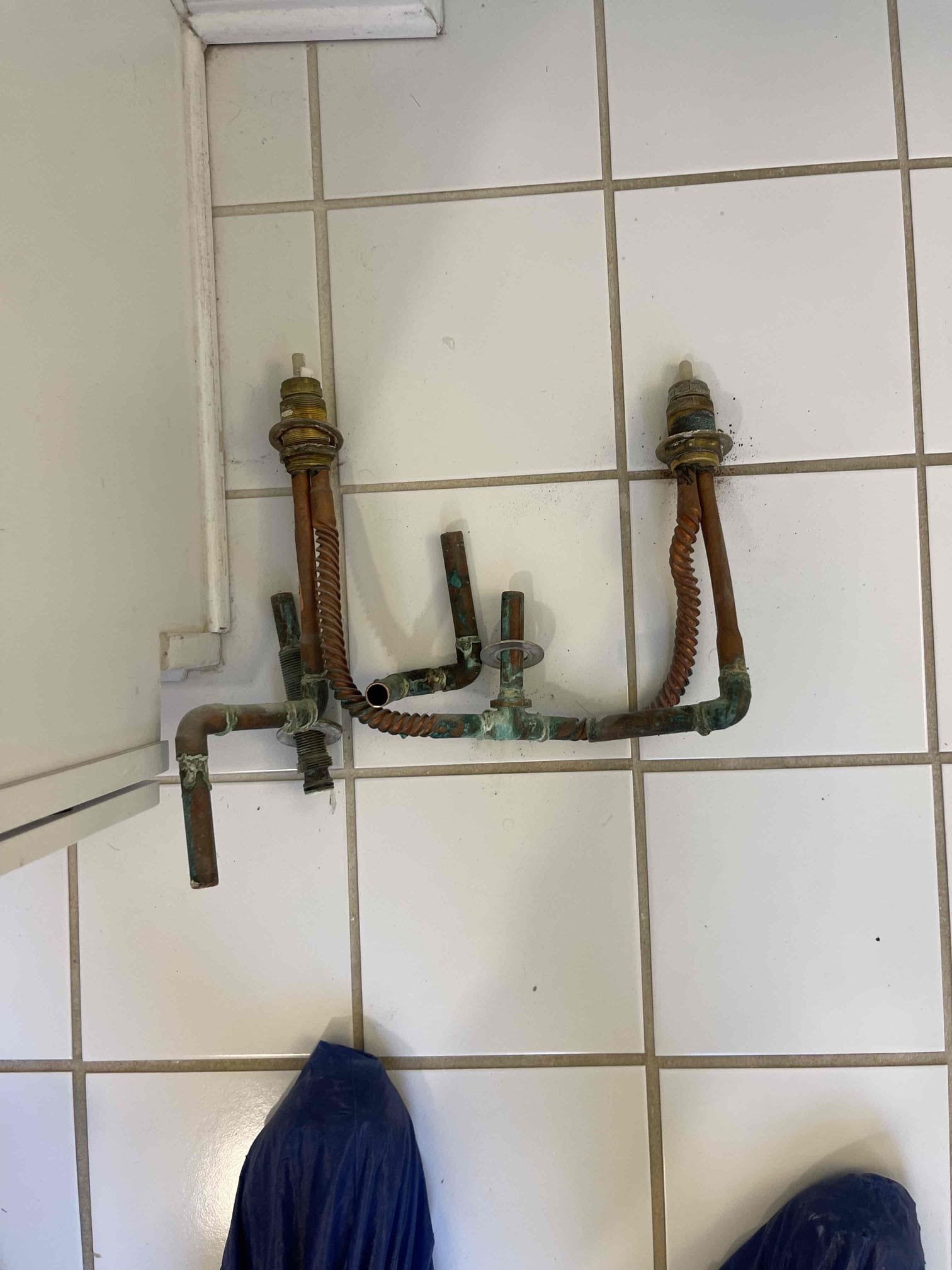 Customer had old tub filler he had removed all of the trim for and bought a new tub filler. Hole he cut in the drywall was too small for us to access the fixture. We tried to remove the front panel but it cracked during the removal process. Installed two stop valves under the whirlpool tub and installed new faucet. No further issue at this time. 