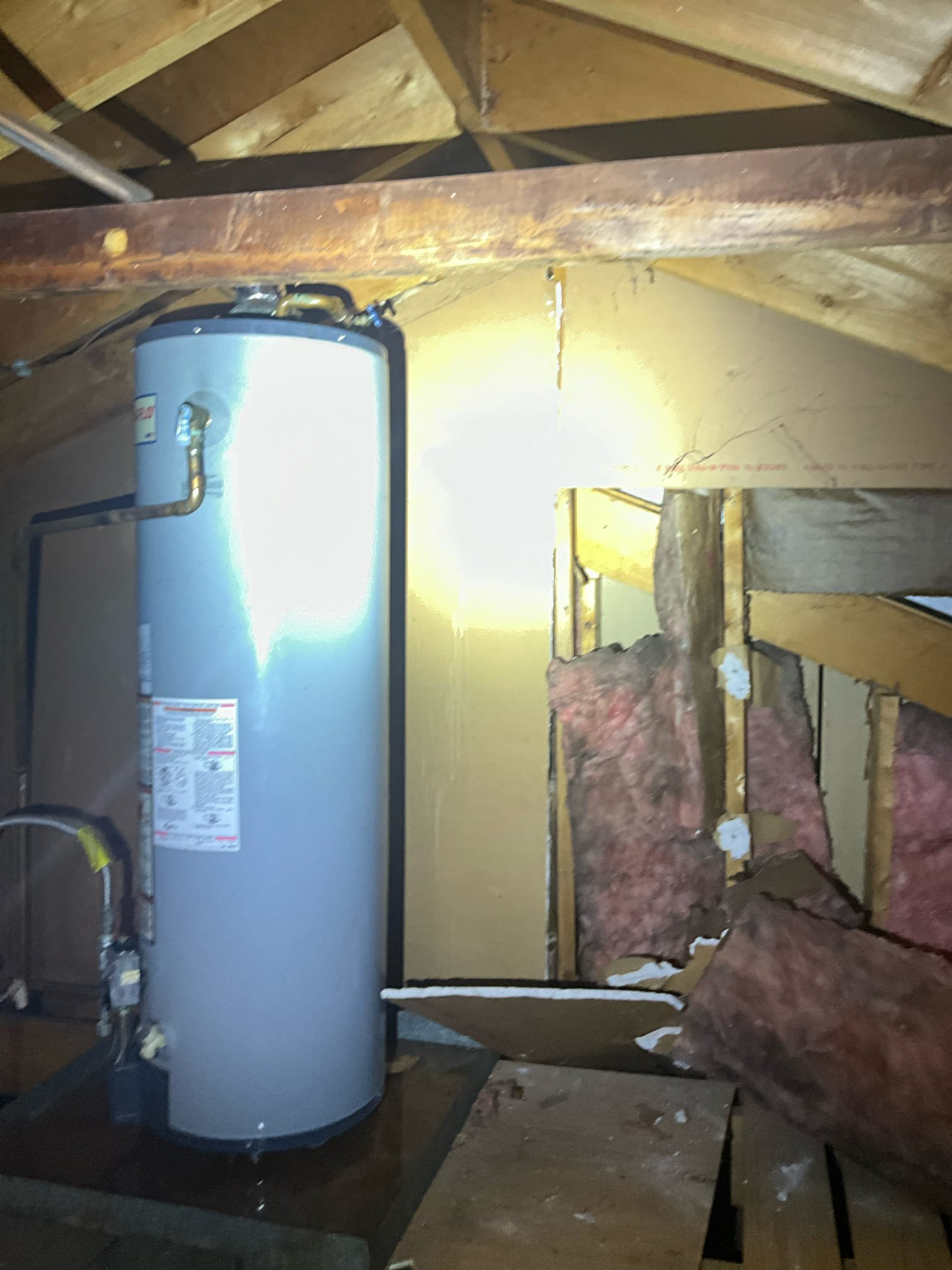 Customer had 40 tall water heater leaking in the attic. Initially check house pressure at 100 psi. Found that hose bib was run before the PRV. Checked the house pressure off of toilet stop at 50 psi. Replaced the heater with a 40 short and disposed of the old heater. Installed new heater in existing drip pan and installed a new thermal and a new shutoff. Tested all work to ensure proper function and no leaks.