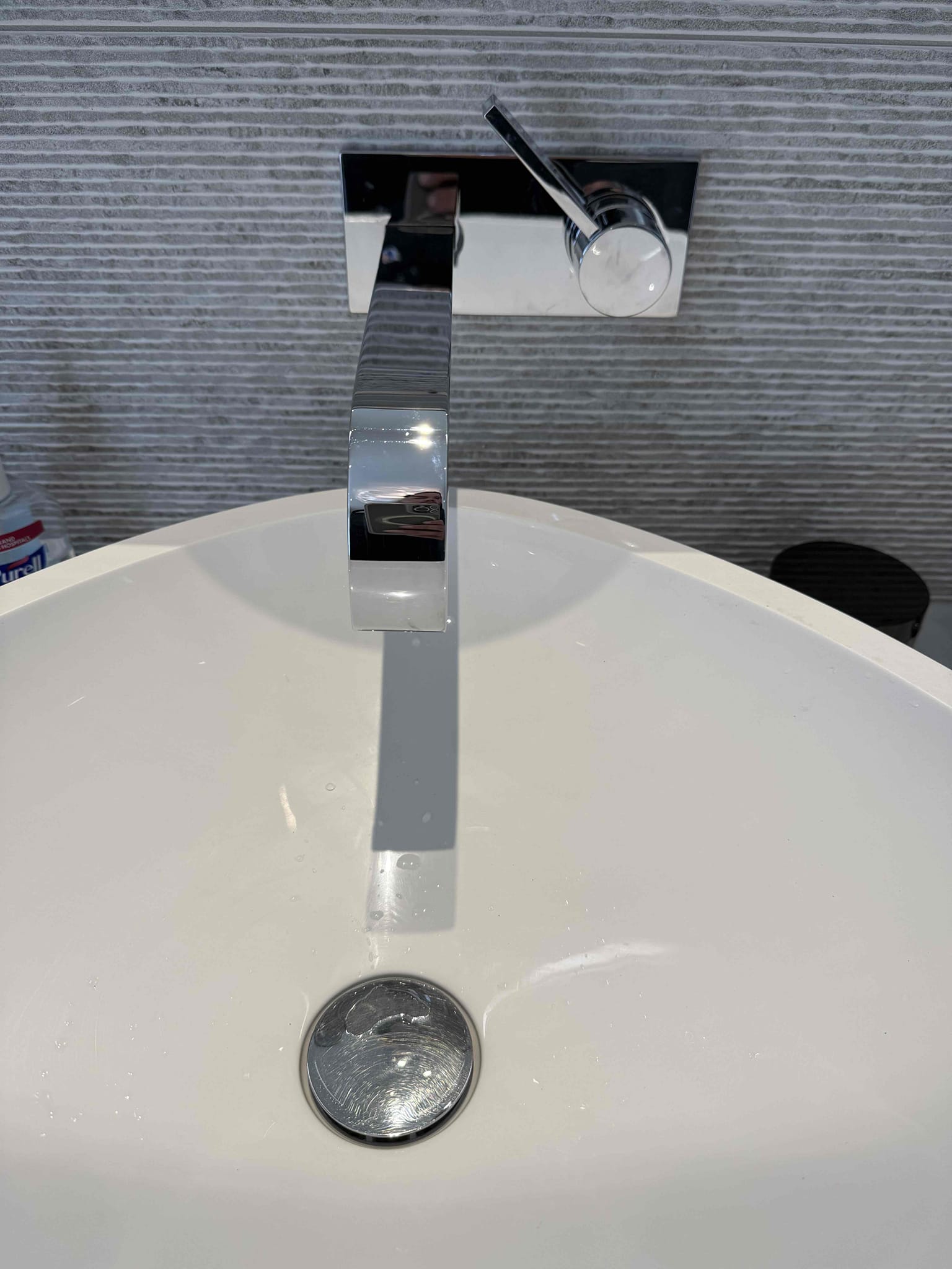 Homeowner states that the master bathroom lavatory faucet right side wasn’t working properly didn’t have any water pressure and the other one left side worked properly. Upon arrival homeowner showed me the master bathroom wall mounted faucet it didn’t have any water pressure and would just open with a small stream of water. I did my inspection and didn’t find anything else wrong so I offered homeowner some solutions and she agreed for me to repair it. I took it apart and cleaned the faucet and cartridge and it was the faucet head that had a lot debris in the flow restrictor so I cleaned it out and it had a lot minerals and some blue teflon which covered one of the holes. Once I cleaned it out and added new tape and dope I replaced it and turned the water back on. I turned it on and it works properly no issues or leaks and homeowner is satisfied with the service provided. 