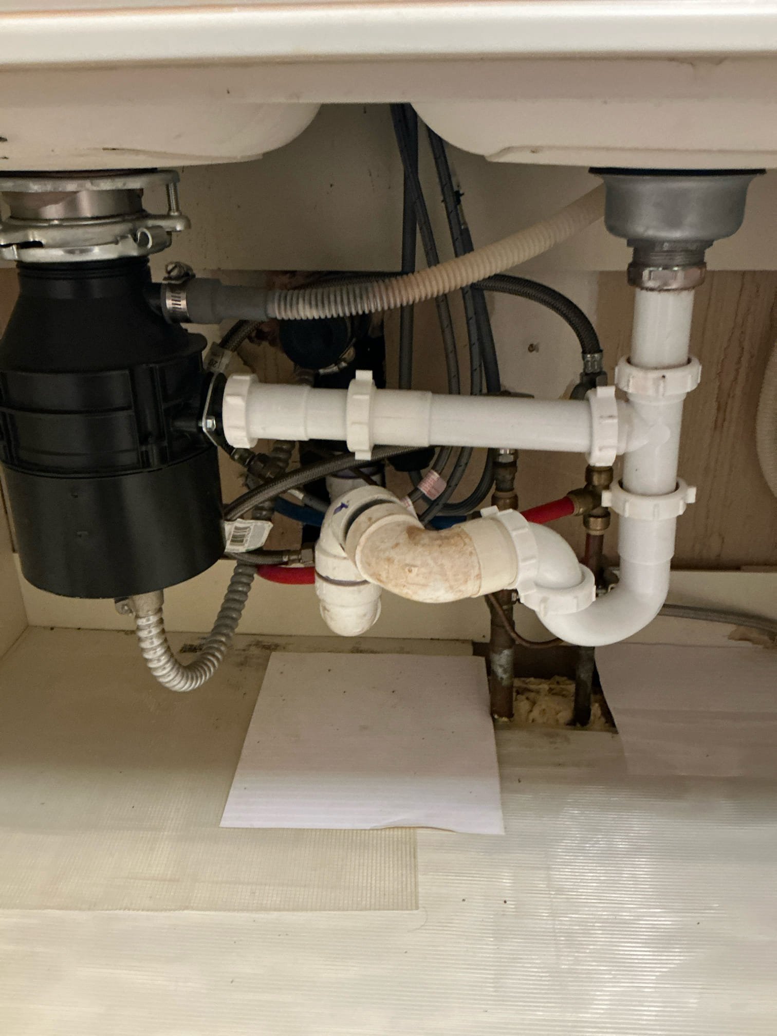 Customer called for seized up garbage disposal, however, went on site. Customer said he flipped reset switch underneath and when I went to test it garbage disposal worked fine. Everything is working as intended at this time. Did leave an estimate for a kitchen re-pipe to remove old S trap that’s in there now.