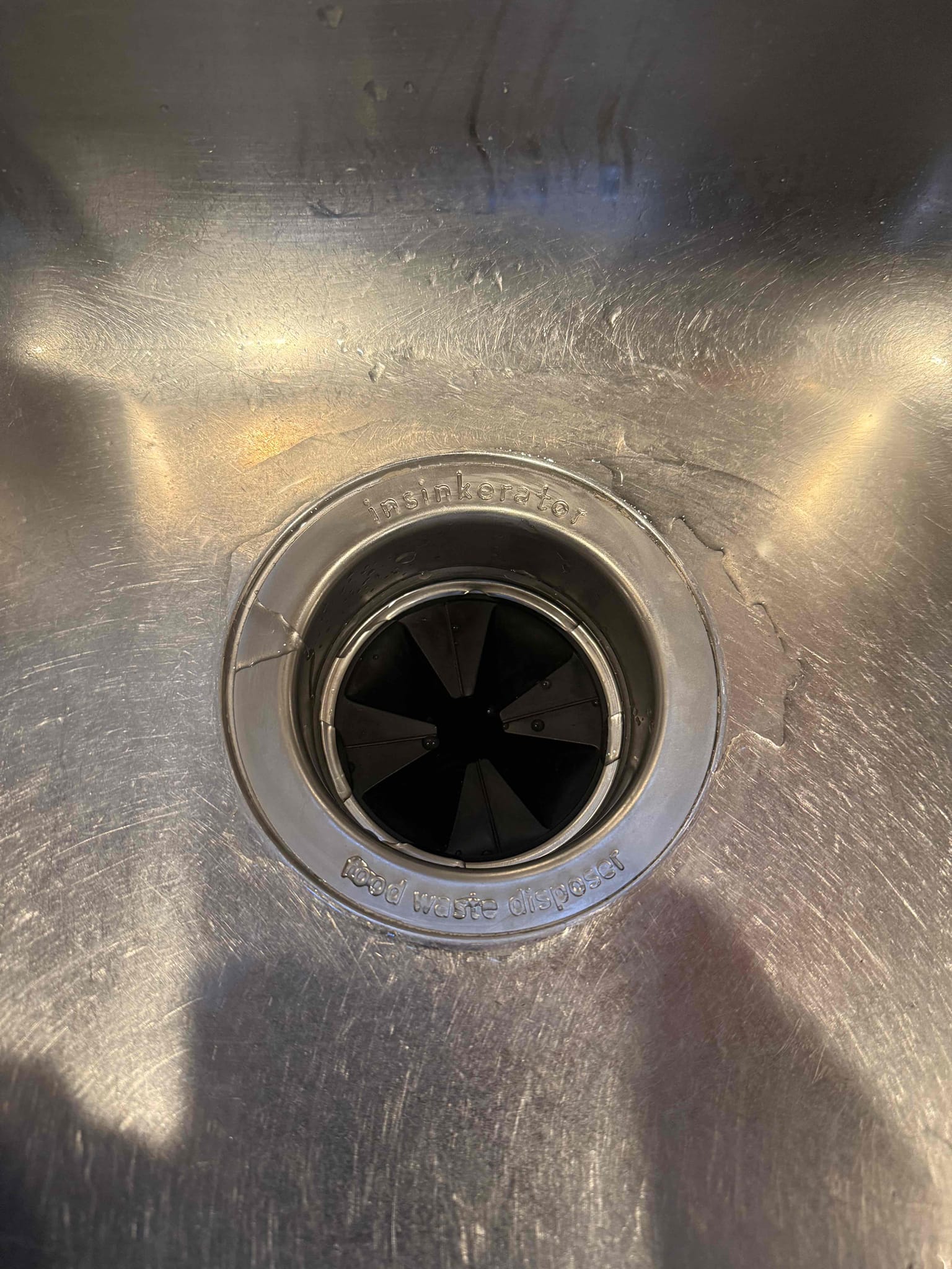 Homeowner states that they had several issues they wanted us to repair when we came out such as 2 leaking hose bibs and a garbage disposal. Upon arrival homeowner greeted me on driveway and explained the situation. He took me to the basement where the GWH is located and main shut off. I did my inspection and found that the PRV was replaced but not the blown expansion tank. I offered some solutions to homeowner and he agreed to fix everything today. I began with the garbage disposal by removing the old leaking model and installed a new badger V 1/2hp with a new collar. Once I was done I moved on to the basement and replaced the expansion tank with a new model pressurized to 75 psi. While I was in the basement I cut the backyard hose bib poly line and attempted to install a new pex pipe but was unsuccessful and will be back with a helper to reinstall the new hose bib. The front yard hose bib I removed by unsoldering the old model and installed a solder male adapter added tape and dope wi