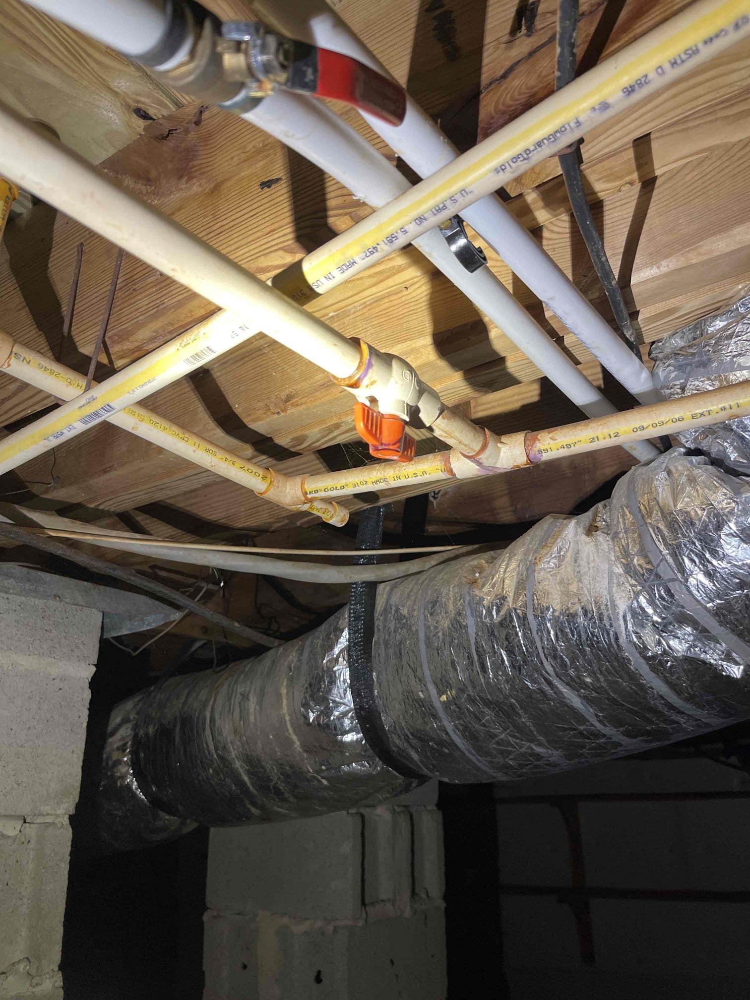 Repiped some sections of Cpvc hot and cold piping in crawlspace to remove all of the slow dripping fittings. Waited for glue to cure before testing. No further issue at this time. Very old tankless water heater. Left quote to replace. 