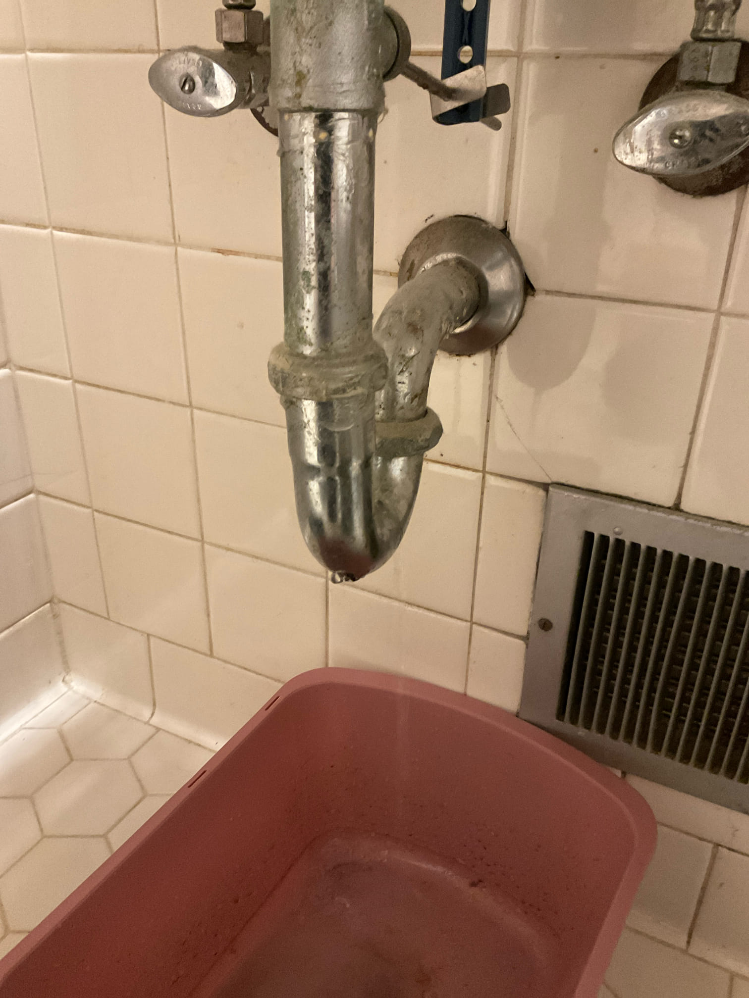 Found there was a whole bottom of P-trap adjacent to where yesterday ran a snake through. Found that more piping was broken so cut into tile and replaced section of pipe and also replaced P-trap. Tested and no leaks were present at this time. Cleaned up work area.

Chen plumbing will not be responsible for any tile repair