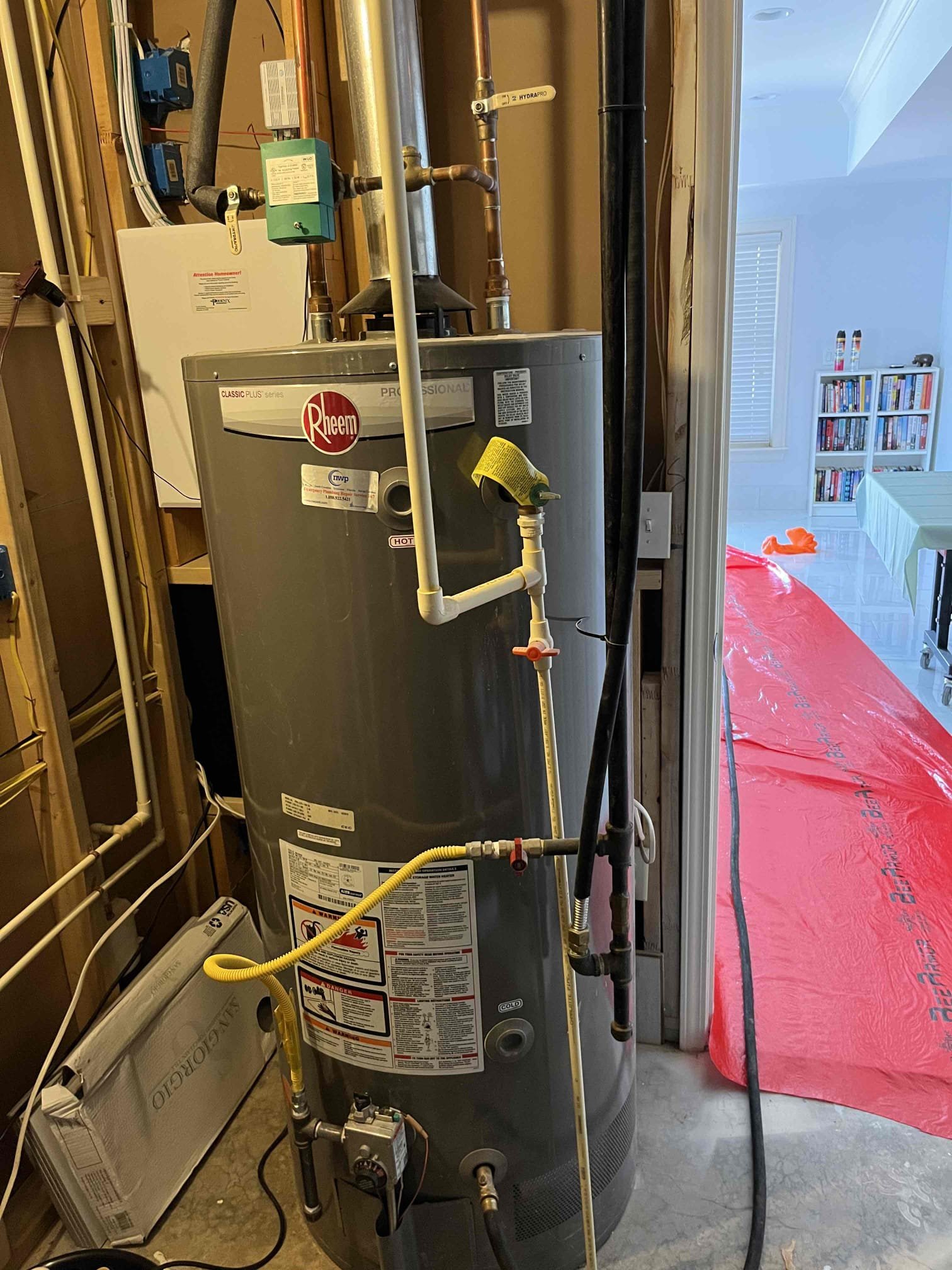Returned and installed a new 75 gallon gas water heater with a new large expansion tank, a new recirculation pump, and new checks/shutoff for the return line. Tested all work to ensure proper function and no leaks. None were found. 