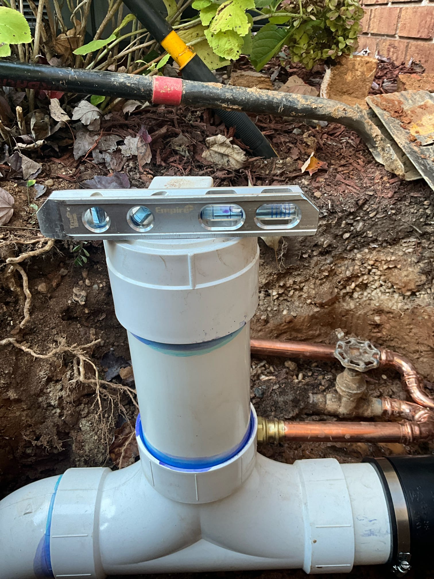 Return to complete quoted work.

Dug up sewer line and waterline in front of house, between house and driveway. 

Waterline was dug up to install a ball valve, as existing gate valve has a snapped stem and gate does not function. Upon digging, we discovered the main line before the valve is galvanized waterline. After gate valve is copper one inch main pipe. Due to small space and restrictions, I rerouted the waterline to allow the installation of a ball valve, and installed a small box to avoid the valve being buried as the previous valve was. Slowly pressurized main line to pressurize building. Building pressurized over 10-15 minutes. 

Sewer line was dug up and replaced from near foundation to mainline 3-4 feet deep. We removed an additional section on site because it was so deteriorated that if fell apart during the course of work. New sewer is pvc, and a two way cleanout has been installed. Measurements notes on profile history if required for sewer replacement next year.

Dig sit