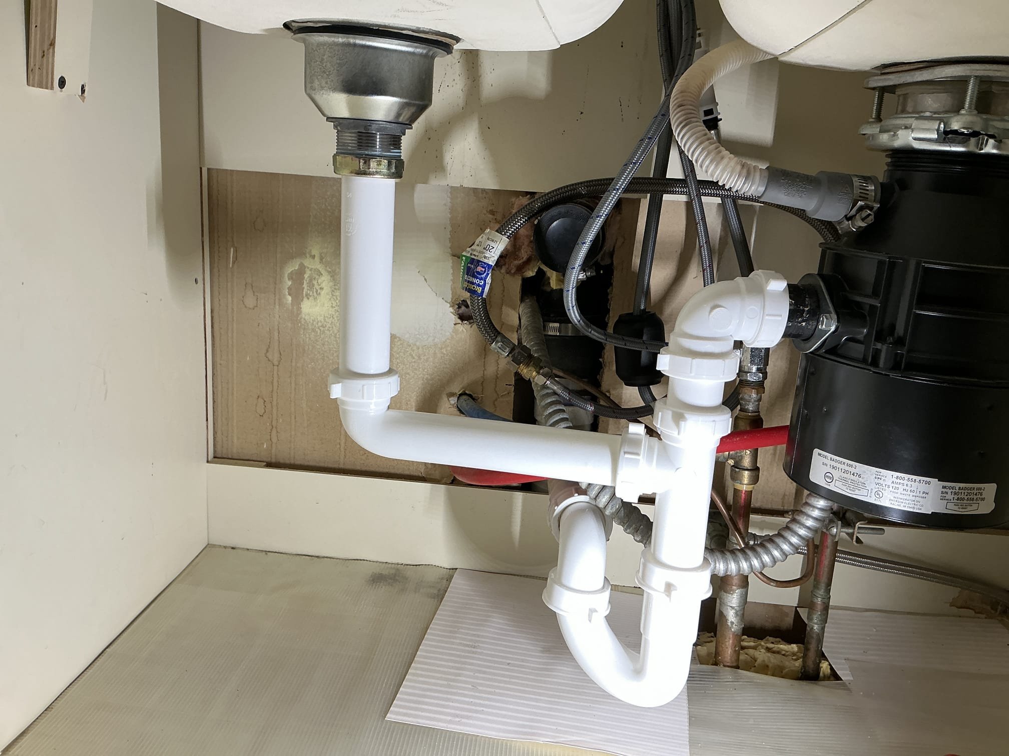 Remove old tubular piping as well as rework pipe  coming from wall and remove old p trap re-pipe, kitchen sink line with new tubular piping.

Performing work mentioned above tested extensively. Everything is working as attended upon departure.