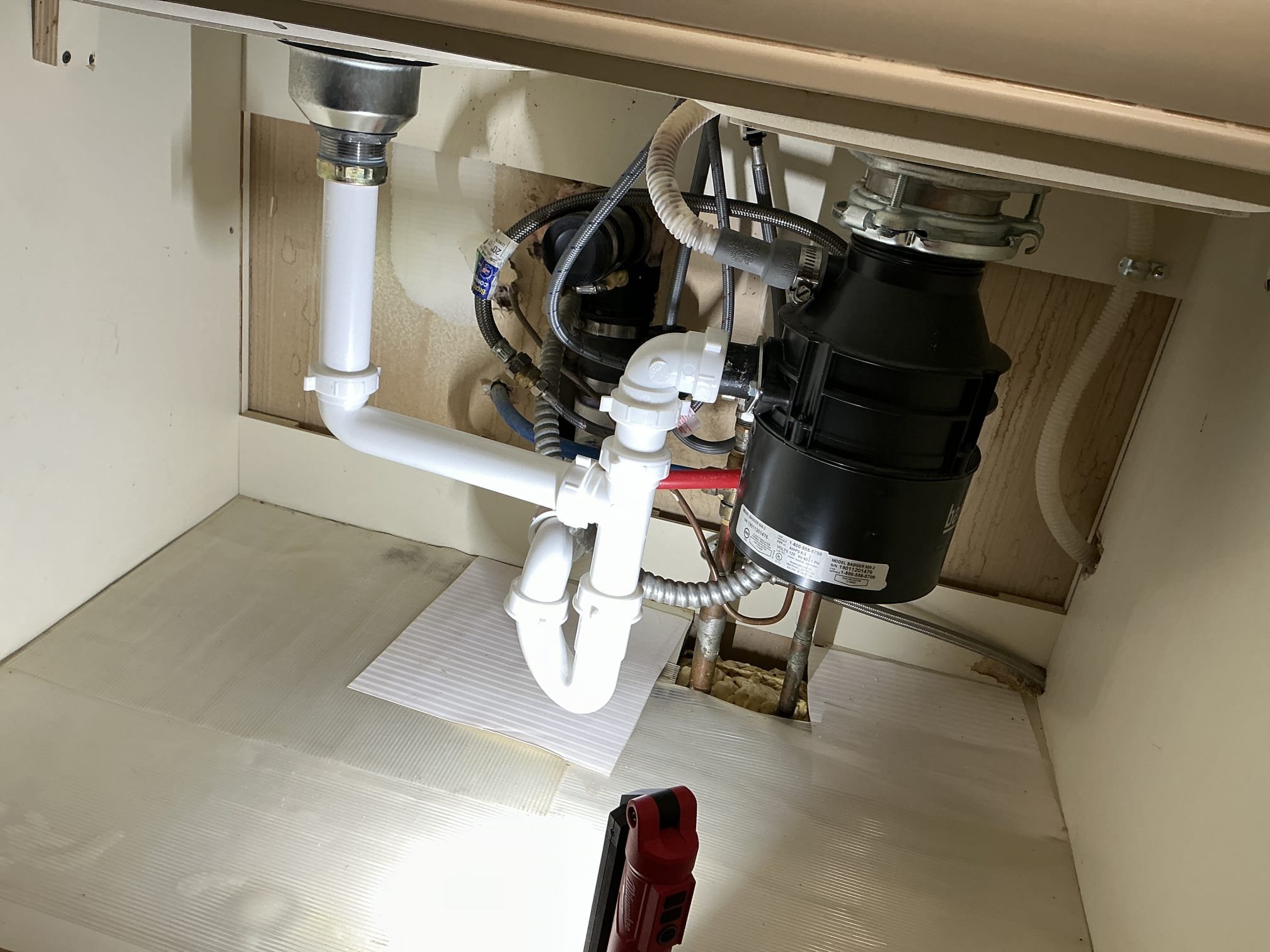 Remove old tubular piping as well as rework pipe  coming from wall and remove old p trap re-pipe, kitchen sink line with new tubular piping.

Performing work mentioned above tested extensively. Everything is working as attended upon departure.