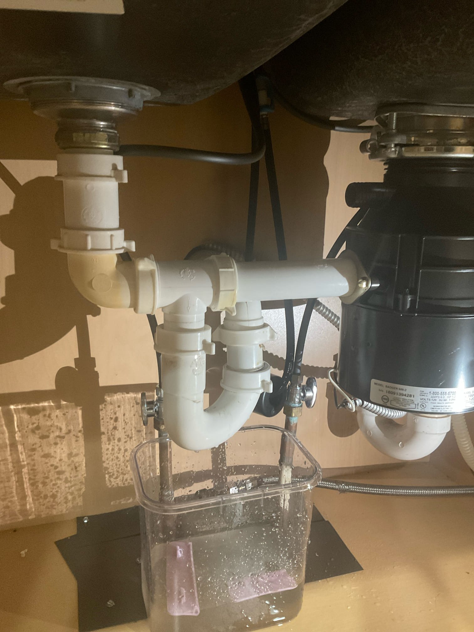 Customer stated that there was a leak under kitchen sink and also spray on dishwasher supply line. Stated to customer that drain under kitchen sink wasn’t installed properly. Recommended to customer to rework under kitchen sink and also install new service valve and water supply line for dishwasher. Customer agreed. Cut hole in back of cabinet underneath kitchen sink to access 2 inch kitchen drain line. Reworked and reconnected back under sink. Tested and no leaks were present at this time and everything was draining as it should. Shut water off to home and replace service valve for dishwasher and supply line. Turned water back on and tested, and no leaks were present at this time. Cleaned up work area.