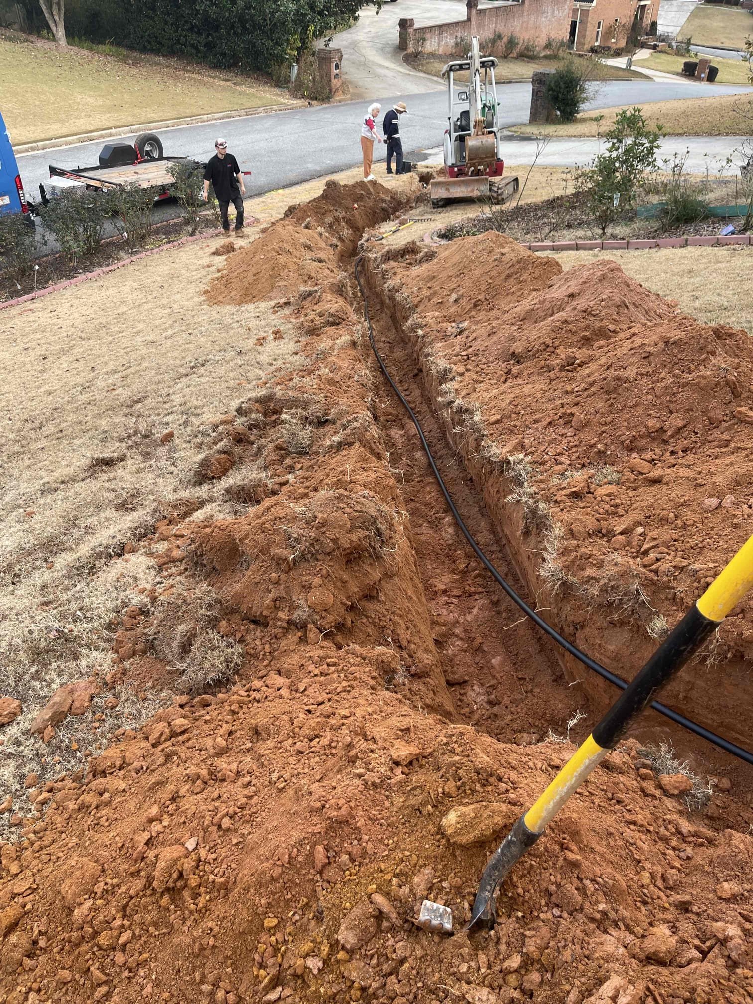 Came out for a leak in the yard. Located leak on a 1” blue polybutelene water service. Notified homeowner these pipes cannot be repaired and must be replaced. Received approval to replace the water service. Trenched from meter to house. Drilled new penetration. Bored under the sidewalk. Installed new PRV and shut off valve. Installed another ball valve inside a round valve box at the meter. 