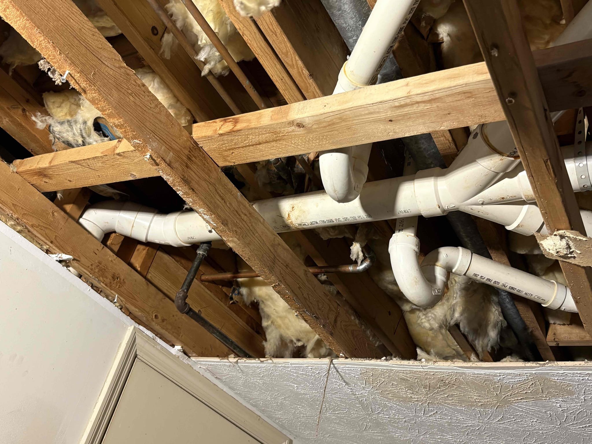 Came out today to perform the full drain repipe for the fixtures on right side of home on 2nd story which were the master bathroom, hall bathroom, and the laundry and vent that goes through the roof. We did this work due to the entire system having back fall, causing the drains to hold water and cause backups, which caused some water damage to the home. Cut old piping out and replaced with all new pvc piping and fittings that are properly pitched so everything flows like it should, downhill.

Got good bit of drains replaced but will need to be back here Monday to finish the drain work and demo both the hall bathroom tub/shower tile surround and the master bath shower tile surround in order to replace the drain pipes for them. We will then replace the hall bath tub with new fiberglass, and client will have master bath shower redone in tile by tile guys. 

Collected 1/2 of original invoice, and have to get quote together for the additional tile demo and tub replacement. 