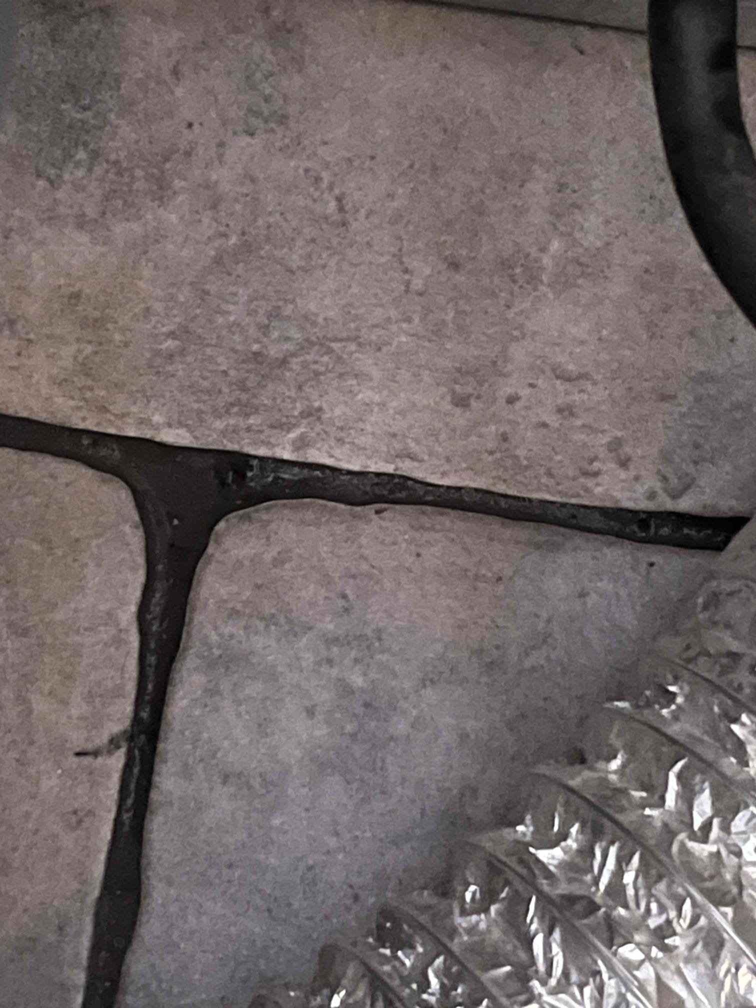 Customer had extensive water staining and pooling in the garage ceiling. Gave customer price to cut ceiling and find the leak due to red and blue pex being prevalent in the home. Opened the drywall and water leaked through from pooling  in the drywall. Noted wet insulation also indicating the leak coming from the subfloor. Saw wet floor penetrations for electric through the subfloor. Opened wall behind dryer and found water standing in the pan for the washing machine above it on the second floor. Appears to be leaking through the pan and into the floor and ceiling below. Isolated the cutoff valves for the washing machine and customer has Reliable Restoration coming out to inspect scope of water damage. Will return tomorrow to install a new 50 gallon electric water heater due to the age of the existing water heater. 