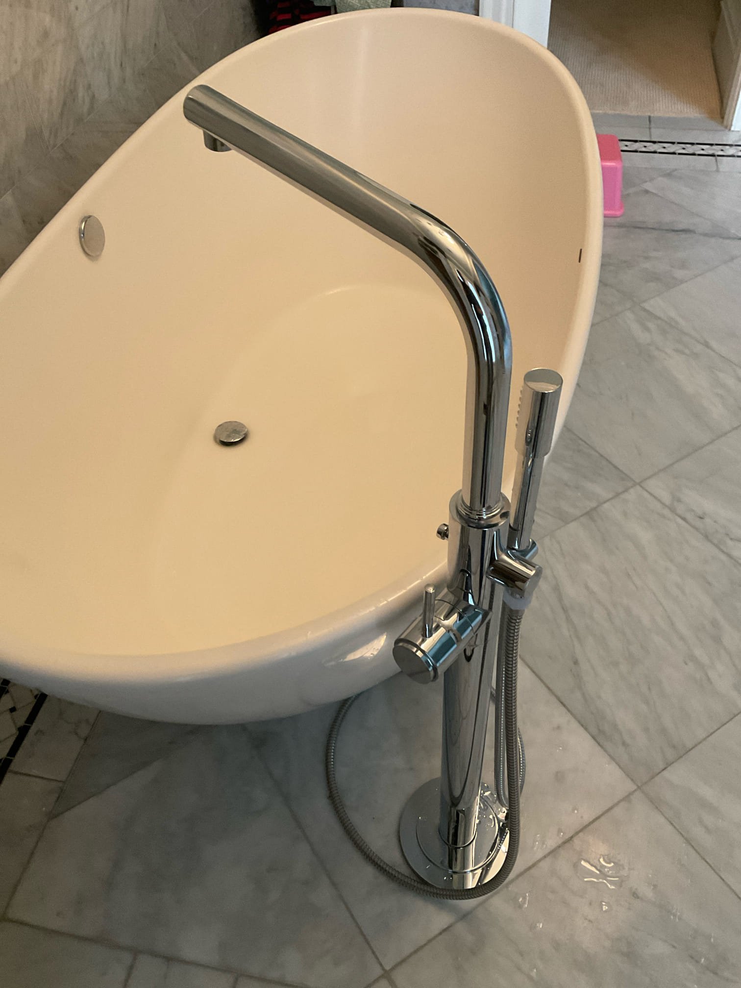 Redo a single handle tub and shower faucet from behind to ensure plate is cover any gap from tile openings, checked tankless water heater , adjust temp higher and also checked found two faucets need new cartridges 