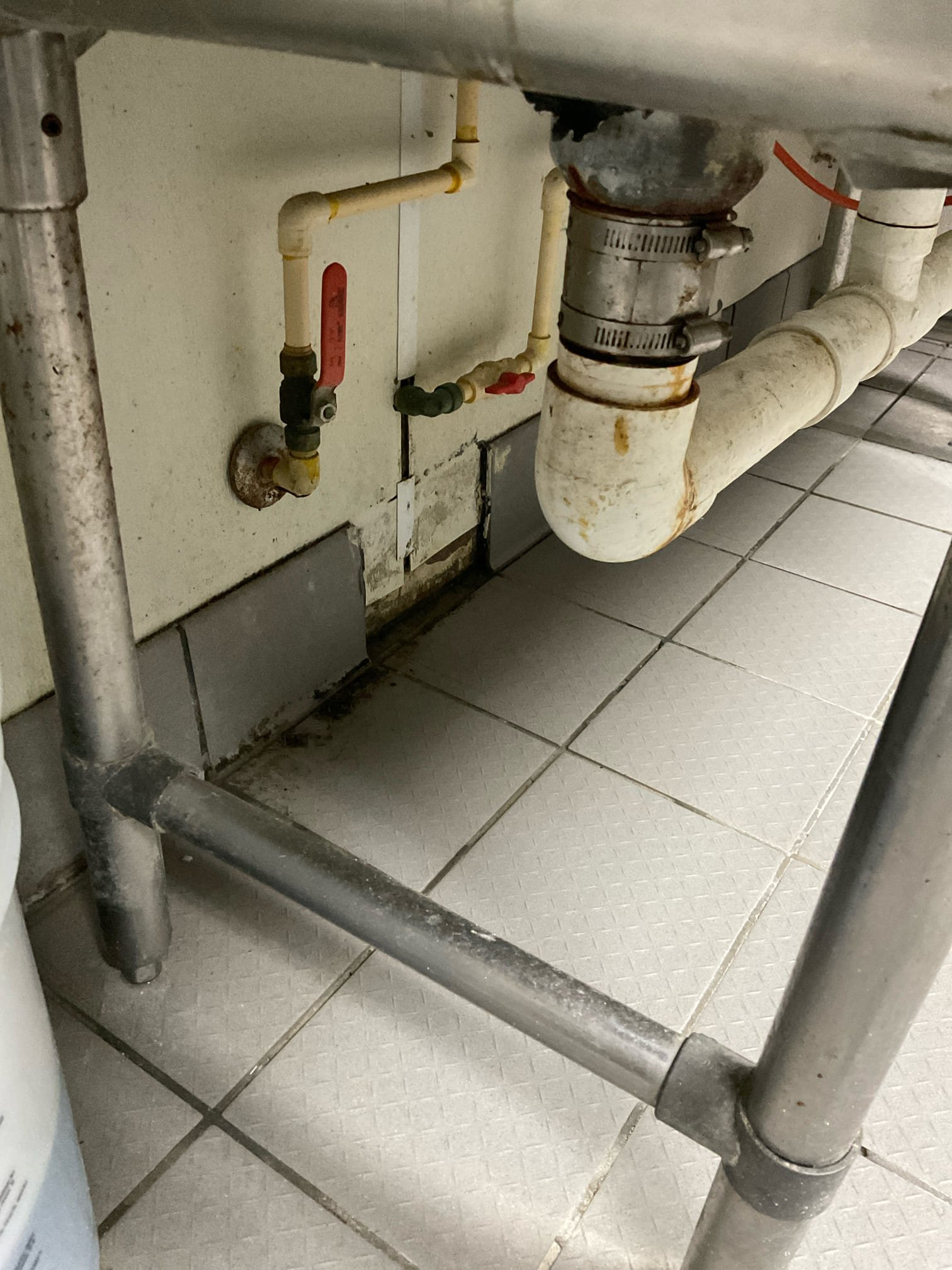 Leak search with wall openned behind and nxt to veggie sink , found a leaking water pipe fitting for mop sink faucet , fixed with copper pipe and fitting , replaced leaking fittings under three comp sink with new shut off valve ,new urinal flush valve installed 