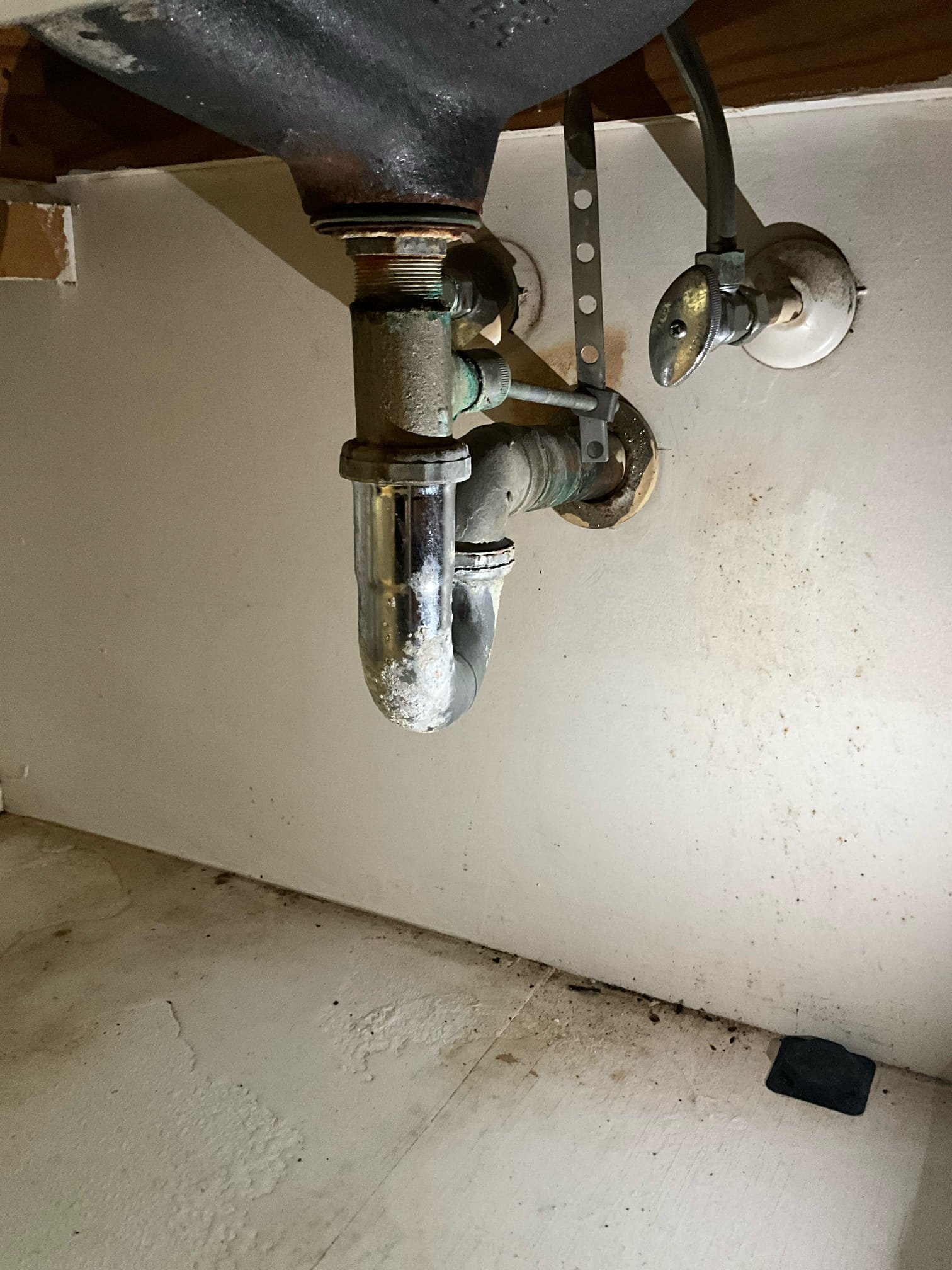 Customer had a leaking chrome trap under sink on main floor. Made customer aware that replacing the whole waste arm into the wall and reconnecting to the stack is recommended. This is due to the likelihood that copper will leak when cut into repair the drain line. Customer acknowledged the risk and requested repair over whole line replacement. Manually cut the copper water arm under the sink and installed a new pop up and a new trap. Tested all work to ensure proper function and no leaks. 