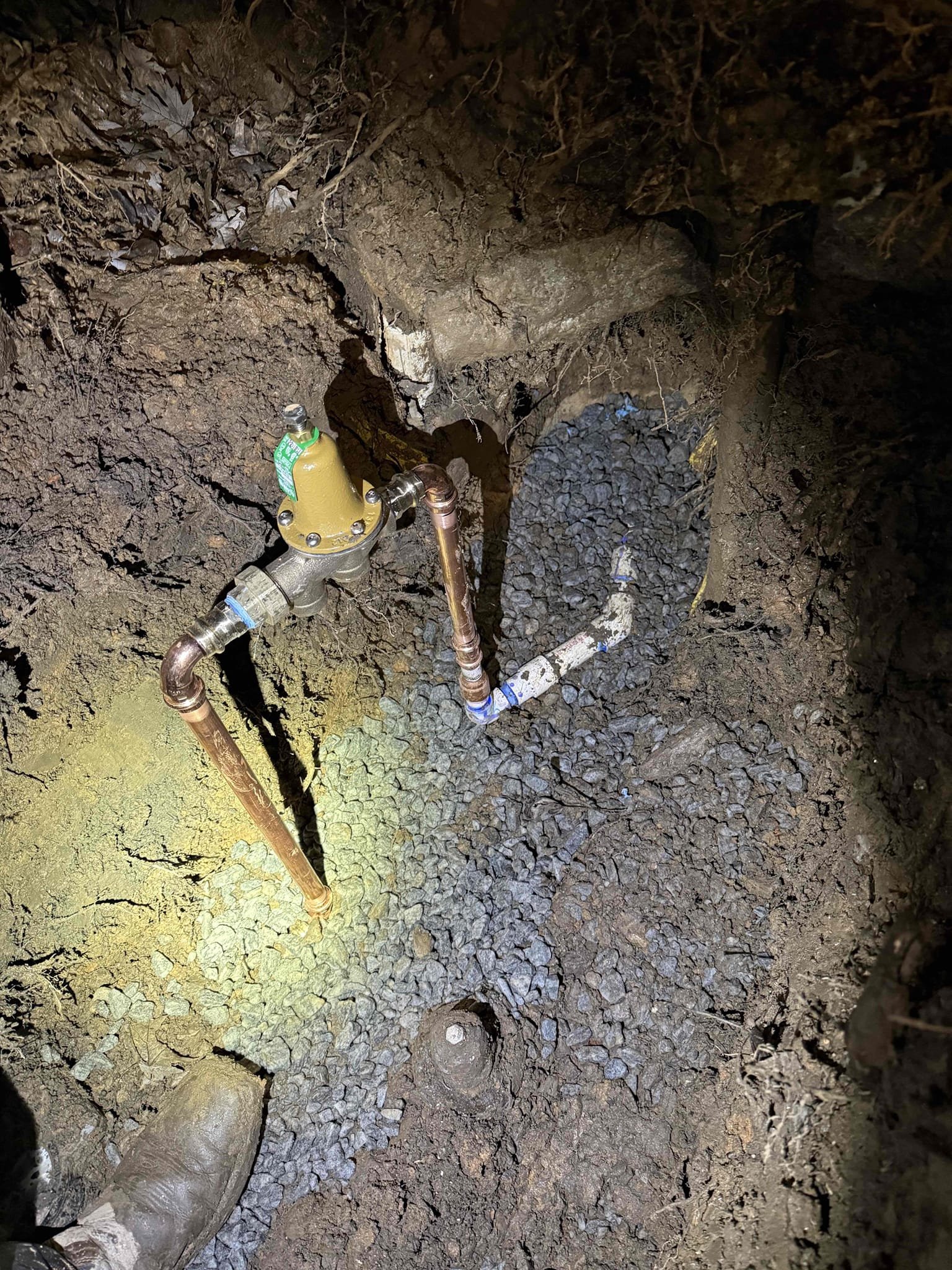 Customer called us out for leak in front of meter box.

Gave starting price to bring out mini excavator, customer approved any repairs that were needed would be additional


Leak detected in 1 inch PVC line near the meter after carefully hand digging around the area we located the leak at the metal to plastic connection upon presenting options to the customer. They approved replacing the affected section of the line. Additionally, the customer authorized us to remove the meter box clear out the mud and re- bed the box with gravel for better stability and drainage,We also replaced the failed PRV and it was positioned for easier future maintenance


 All work is  tested and confirmed to be functioning as intended at the time of departure.


Meter box and meter wires were damaged prior to us digging line. We are not responsible for those sensors 



compacted dirt as best as we could cleaned up area as best as we could.



For future reference, please note the layout of the meters inside 