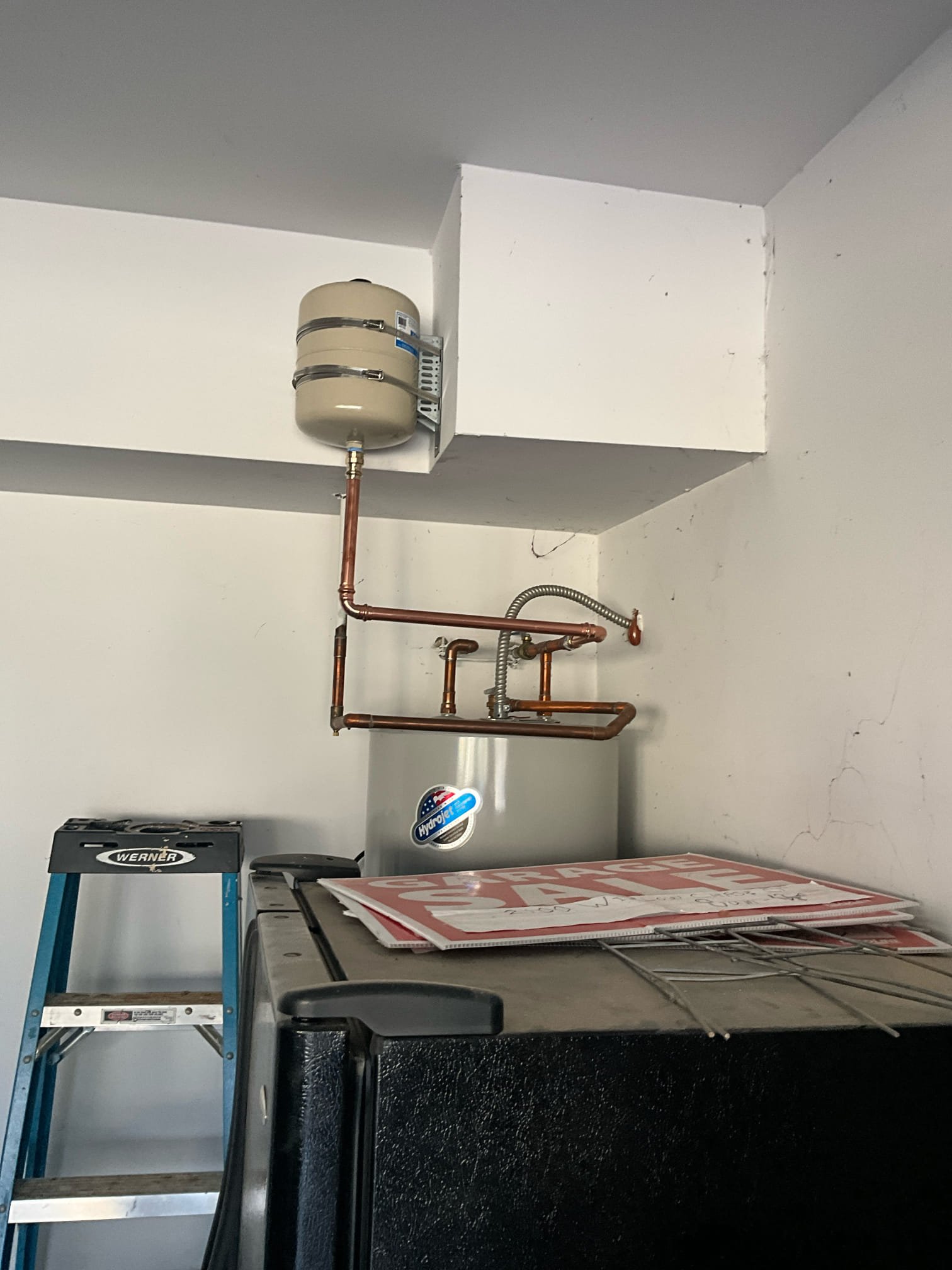 Customer had an loosely secured thermal expansion tank above water heater in the garage. Removed the old, failed thermal, and installed a new thermal on a bracket in the garage above the heater. Both the house pressure and the age of the heater are in a safe range. 
