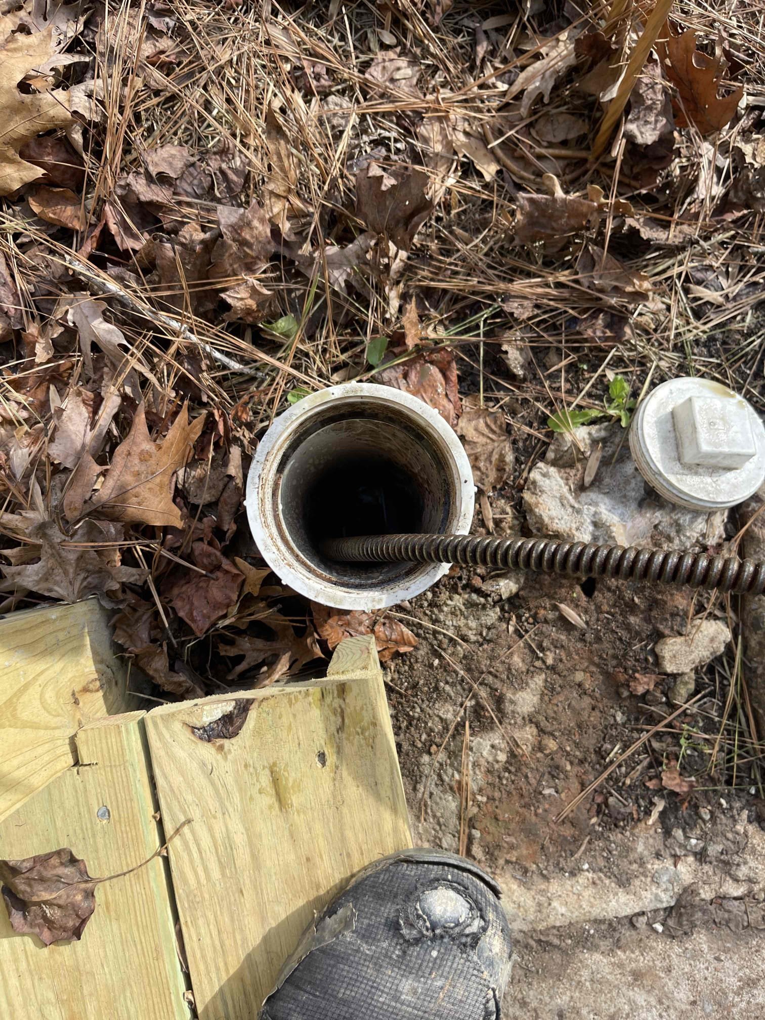 Came out for a back up. Customers basement bathroom was not draining. Septic tank was replaced a few months ago. Opened cleanout and found it was holding water. Ran camera down and located blockage prior to the septic tank. Had to use sewer machine to snake the blockage and clear it. Cleared blockage and inspected location. Did not see any problems in the pvc section. We turned the camera back towards the house and inspected the cast iron under the slab. Multiple partial blockages. Cast iron is very rotted and snagging paper. Sections of the pipe have rotted out and are holding water. Back up will occur again if pipes are not replaced/relined. Gave them referral to zurn to reline the mainlines if desired. Gave quote to jackhammer slab and replace the pipes.