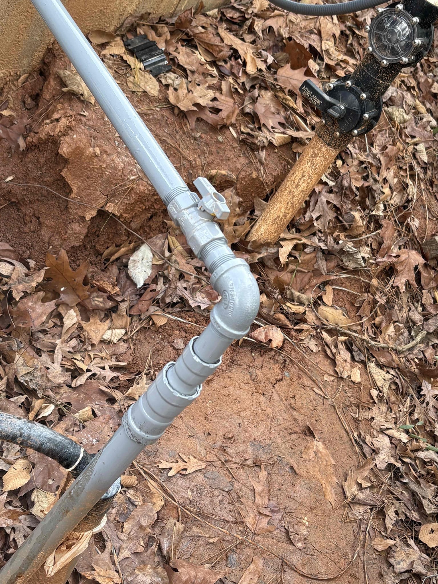 Returned to finish hooking up gas connections at the gas meter and at the pool heater in back yard. Hooked up at meter with new shutoff and union. Tested, no leaks. 
At pool heater we added new 3/4” gas regulator with proper sediment trap and shutoff within 6’ of the appliance per code, then tested. No leaks. 

Spray painted all gas piping gray to prevent rust per code. 