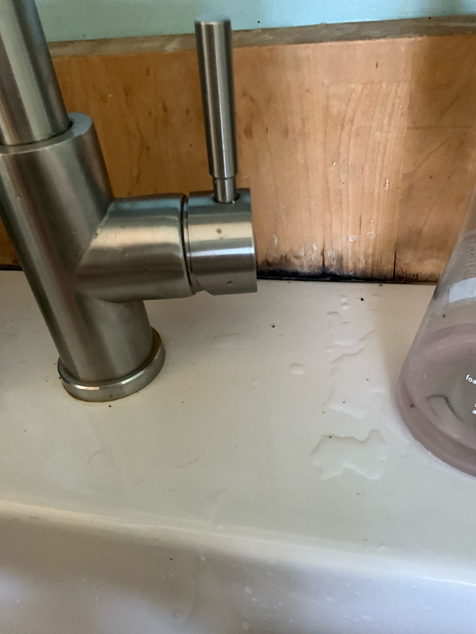 Call for leaking dishwasher stop valve.

Arrived and spoke with Mr. Brennan. He has the main house, and an additional tiny house in the back. The tiny house had a new dishwasher installed and the shut off valve developed a leak. 

Assessment shows that the shut off valve is old, and corrosion present along this section of pipe. I attempted to check water pressure, but hose spigots are winterized, and the water heater is incredibly old and has a plastic twist port. Also found loose p trap nut, and tightened to prevent continued drip from drain. Noticed a third drip spot and found that water has been splashing back along wooden backsplash, and wood appears to not be waterproofed. Recommend handyman address this issue to prevent further damage behind and under sink.

I cut away corroded valve and pipe, and installed two dedicated quarter turn shut off valves. Reattached faucet and dishwasher, checked for leaks. 

With the exception of the water heater, no immediate concerns present in tin