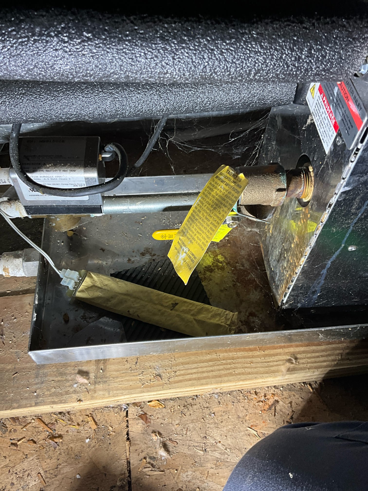 Call for steam shower issue.

Arrived and met with Austin and Ms. Josephine. Austin states that the steam unit in the master shower has power, but won’t produce steam. It has been installed for many years, potentially 7-10 years. It has worked fine until the last few months. 

Inspection revealed the following:
Steam control unit in shower does have power. Steam unit is located in the attic above master bathroom. Flood stop automatic shut off was showing that it has activated, and the valve was closed. Rust marks and signs of water escape present on the side of the unit and the drain pan. T&p line empties straight in to pan above flood stop sensor. I turned valve open, and Austin stated steam unit still not functioning. To ensure we assess the entire system, I went to check water pressure at the water heater. Water heater located behind master bathroom on second floor (there is another water heater in the home). As soon as we found the water heater I discovered the install has signific