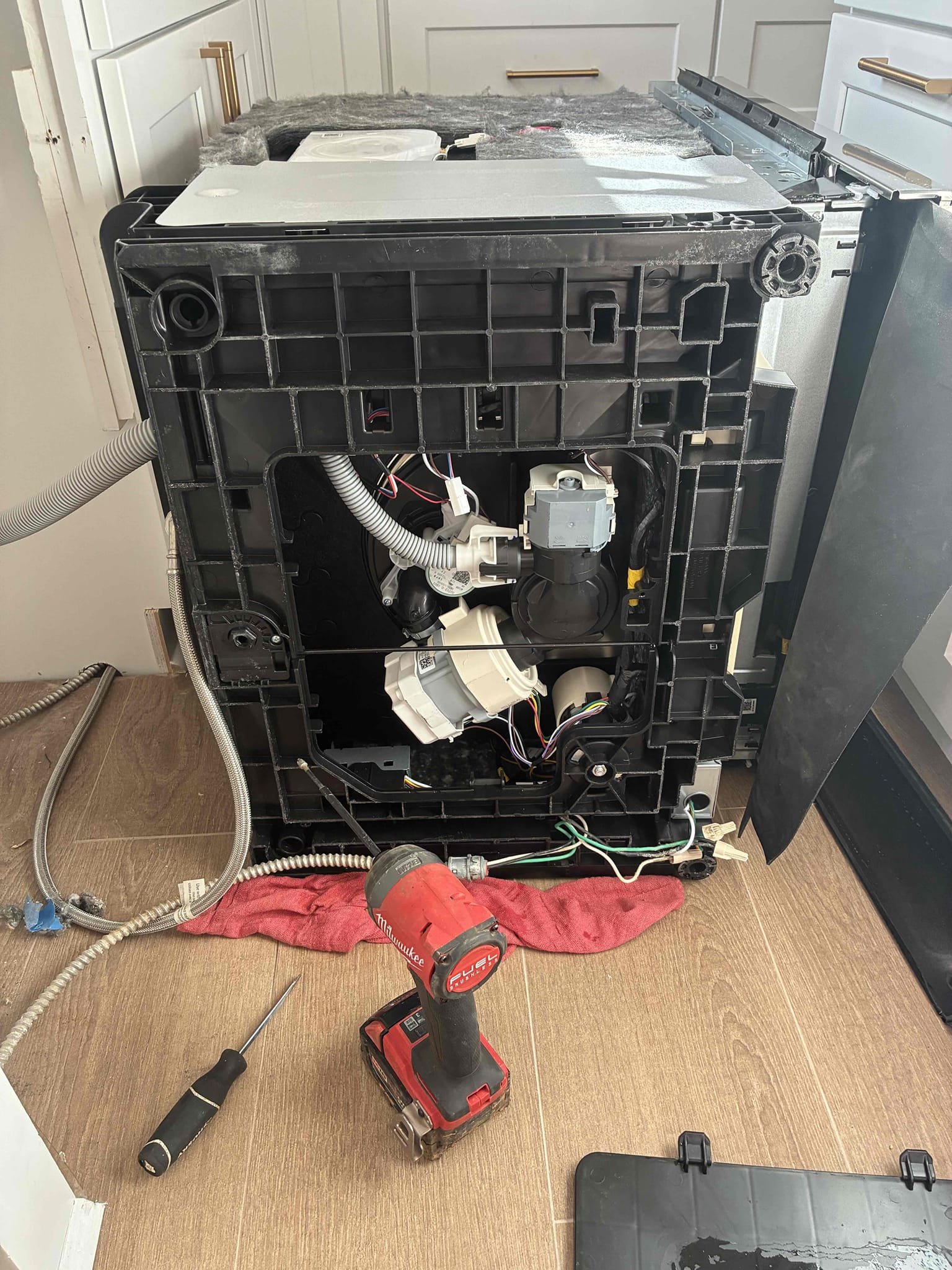 Dishwasher installed by reliable not functioning properly. Found drain hose loop to be issued and drain plug on disposal not removed causing dishwasher to backflow into washer. This caused an error code and water to get within washer. Removed washer and then disassembled parts to get to moister sensor. Dried washer throughly and dried sensor in washer. Also found water valve to washer to be off. Valve is failed still allowing water to service washer. Turned on water and replumbed washer. Turn on washer and checked for leaks and proper function. Customer will have reliable return to mount washer. 