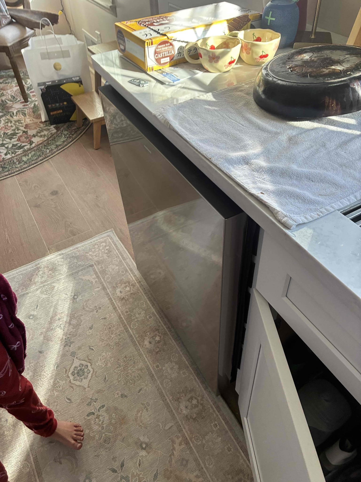 Dishwasher installed by reliable not functioning properly. Found drain hose loop to be issued and drain plug on disposal not removed causing dishwasher to backflow into washer. This caused an error code and water to get within washer. Removed washer and then disassembled parts to get to moister sensor. Dried washer throughly and dried sensor in washer. Also found water valve to washer to be off. Valve is failed still allowing water to service washer. Turned on water and replumbed washer. Turn on washer and checked for leaks and proper function. Customer will have reliable return to mount washer. 