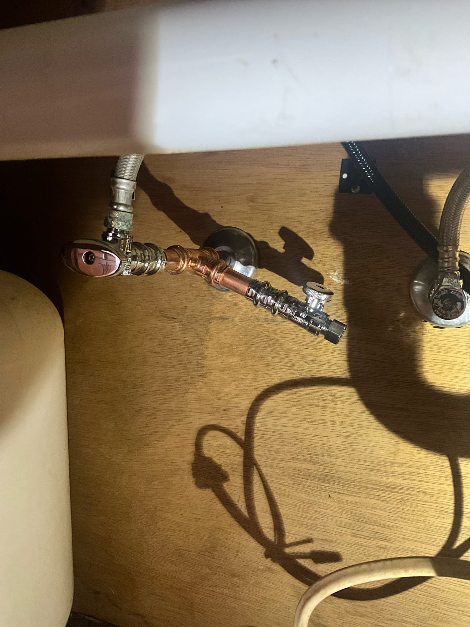 Customer had an appliance company come to install a new dishwasher and they stated they couldn’t due to the shutoff and drain not being in the same floor. Cut and capped the drain and water line below, and installed a new stop and dishwasher wye under the kitchen sink. Tested all work to ensure proper function and no leaks, none were found. 