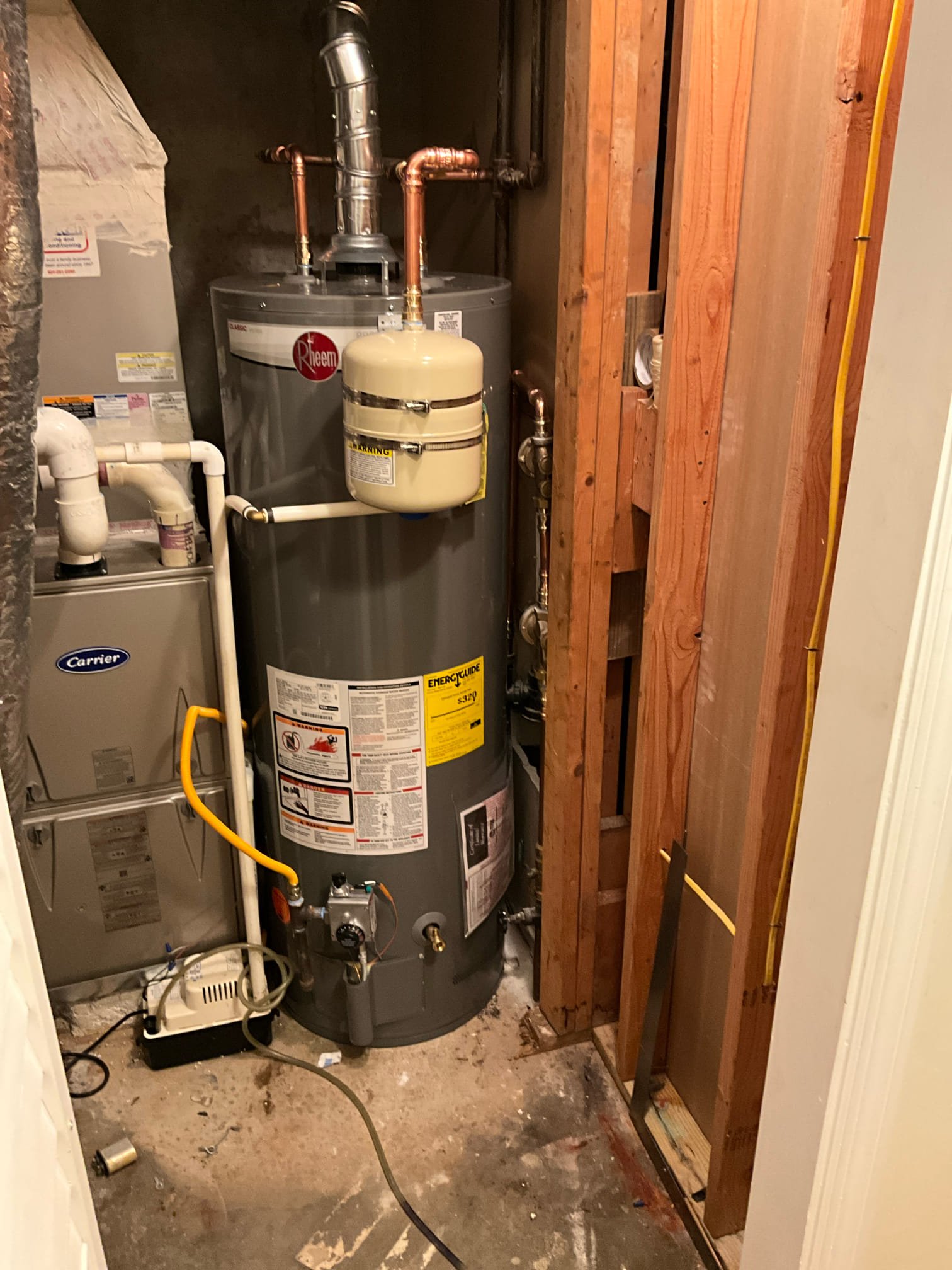 Call for leak in ceiling. 

Arrived and found copper pipe has leak in ceiling of basement. While investigation I also found a leaking pressure regulating valve, an additional leak in the utility room. A thermal expansion tank with ruptured bladder, and. Ten year old water heater. 

Installed a high pressure and regular pressure regulating valve due to excessive pressure. Replaced water heater, new thermal expansion tank and shut off. Drip pan would not fit due to HVAC unit being too close. Replaced both dripping sections of copper. 

After all work we pressurized home, checked for leaks. Water heater is on and heating. Restoration crew contacted to help with water damage to basement.