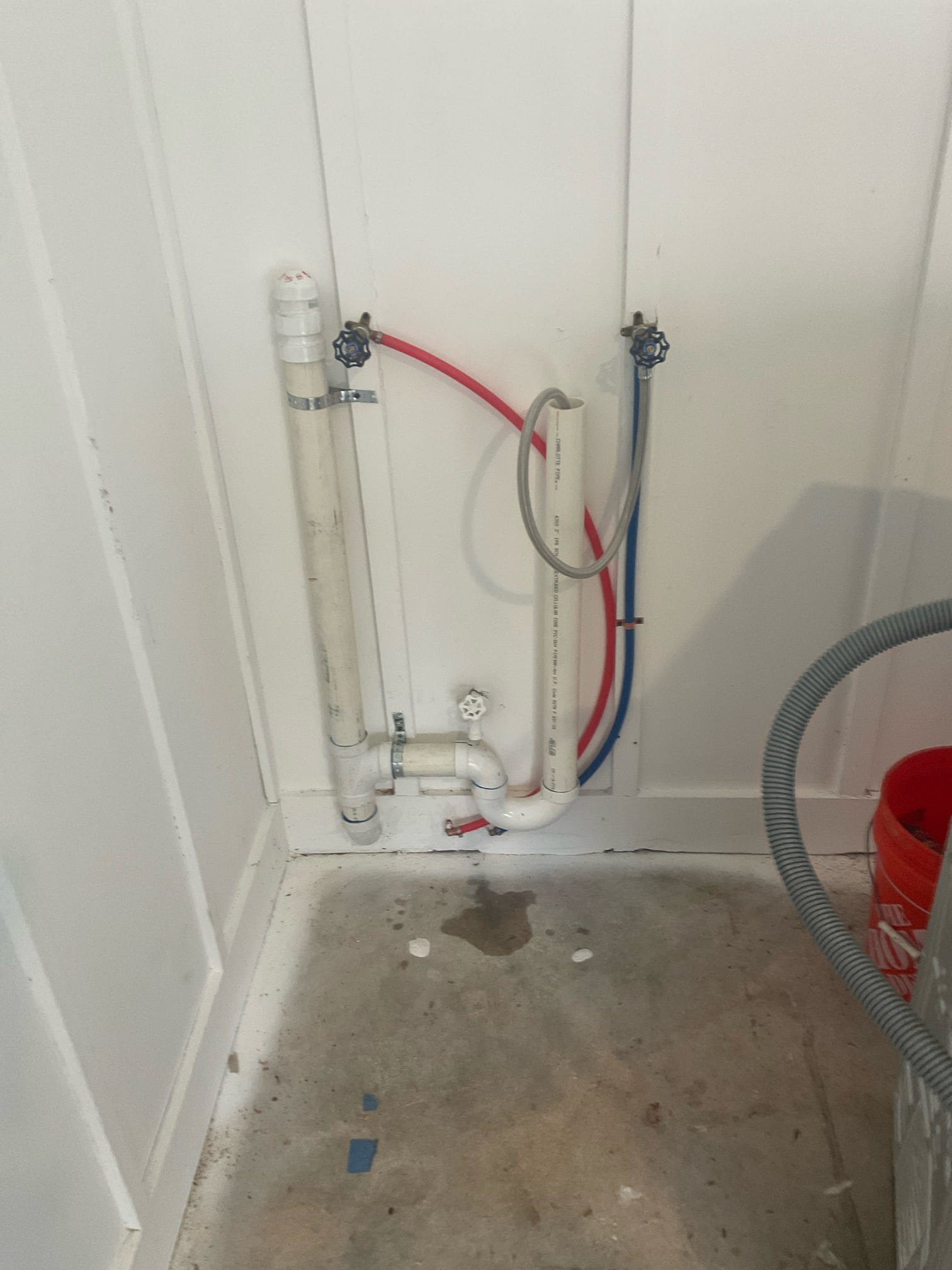 Plumbing installed for washing machine at garage , hot and cold water line with shut off valves , drain connection and AAV installed 