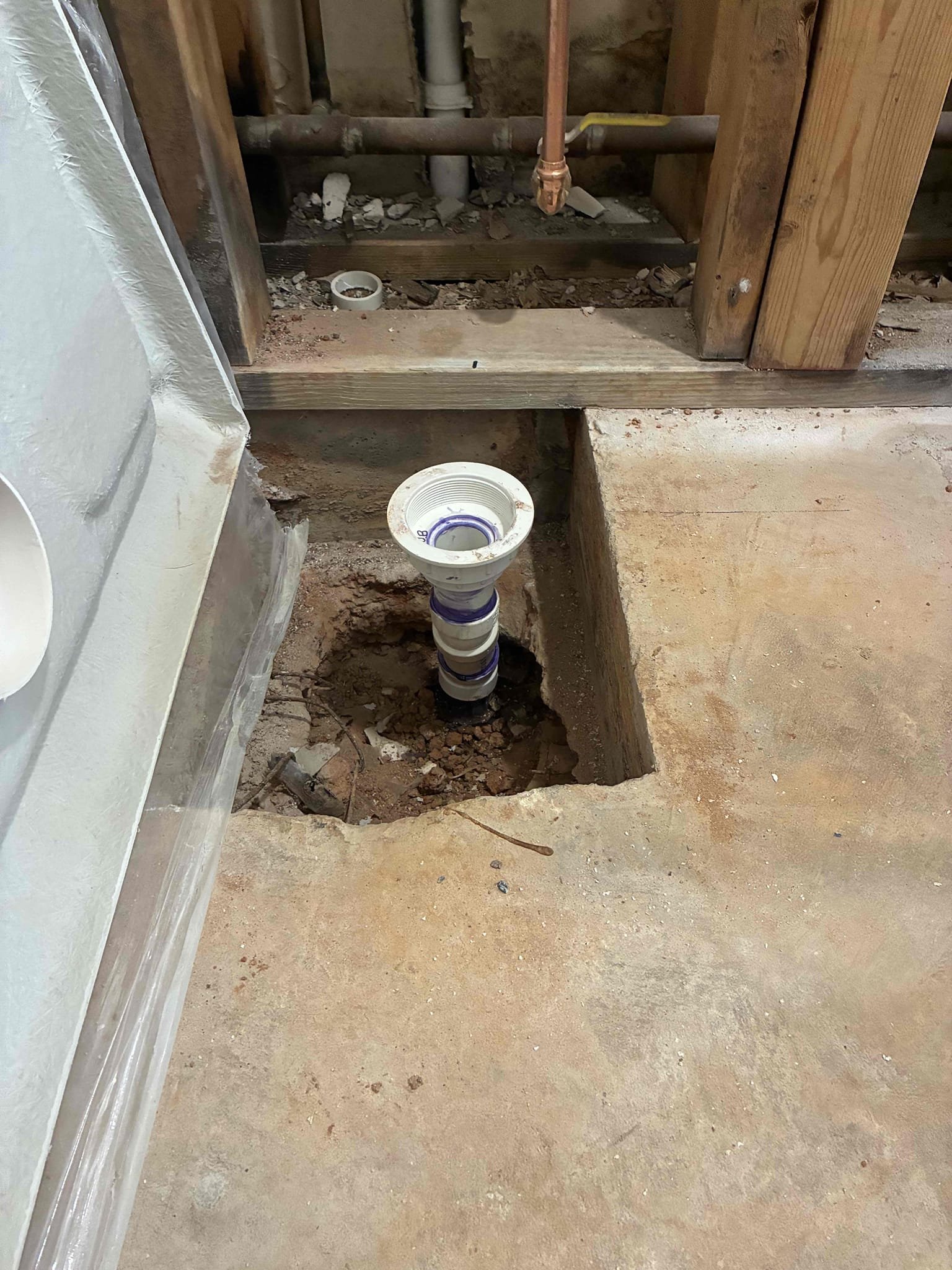 Roughed in customer provided shower drain and shower valve. Customer is going to install trim out after shower stall is put into place. Explained to customer about customer provided parts and also explained dimensions of shower valve and drain. Checked all area of work for leaks and proper function. Not responsible for open drain work. Customer is in process of remodel.