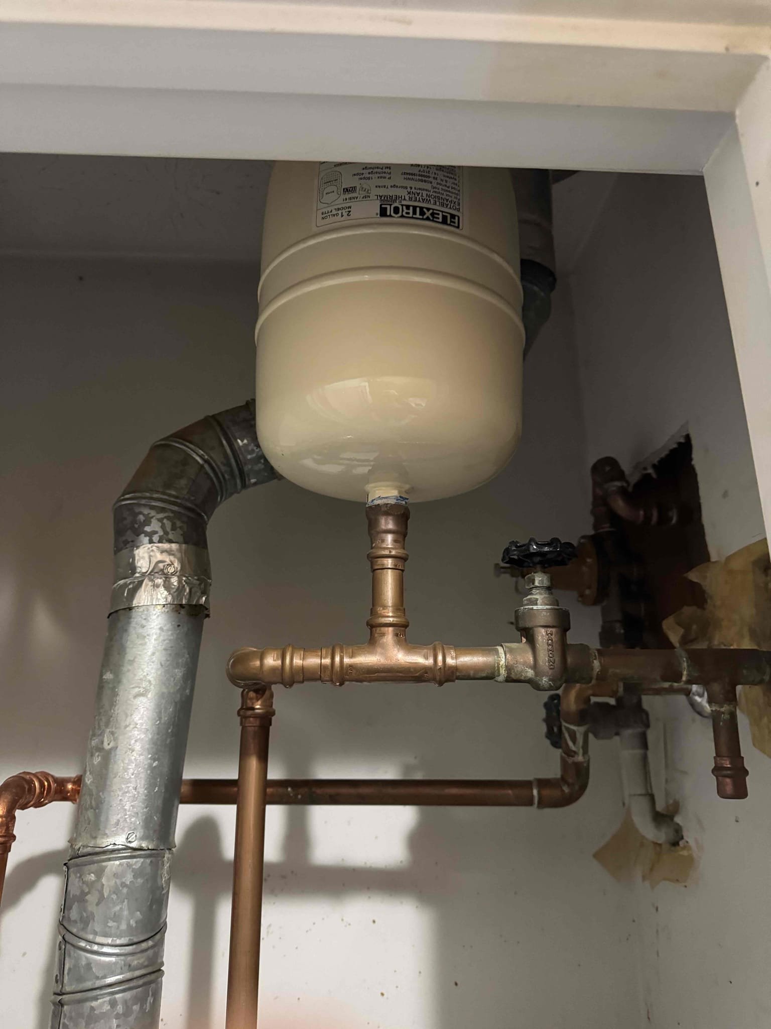 Customer stated that they were having a high water bill for a little while now, and also that toilet in master bath was running. Shut toilet off that was running and spotted meter. Didn’t notice meter moving. Also tested water pressure to home. Found that thermal expansion tank has also failed. Gave customer quote to rebuild one toilet and replaced thermal expansion tank. Went ahead and furnished installed new thermal expansion tank with bracket and installed it. Tested and no leaks were pressed at this time. Rebuilt toilet by replacing fill valve flapper and supply line. Tested and no leaks were present this time. Also checked out other toilets and didn’t notice them running. Cleaned up work area.