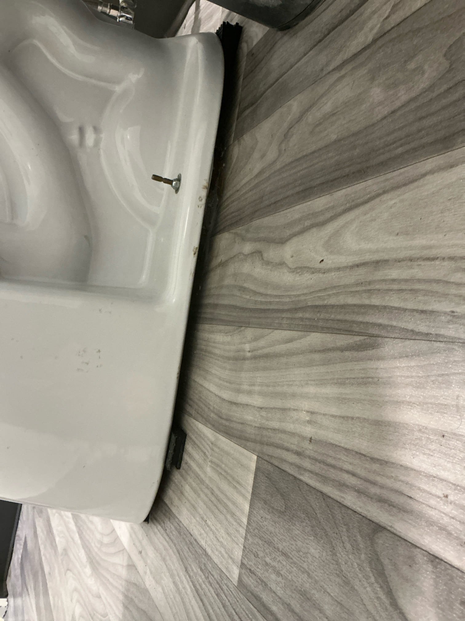 Came out to assess the wobbly toilet in staff bathroom. We did not set the toilet flange, the flooring guys did. The toilet is an inch off the floor on shims all around and the flange is not properly secured or fastened to the concrete. Gave estimate to properly fix. Client will let us know at a later date.