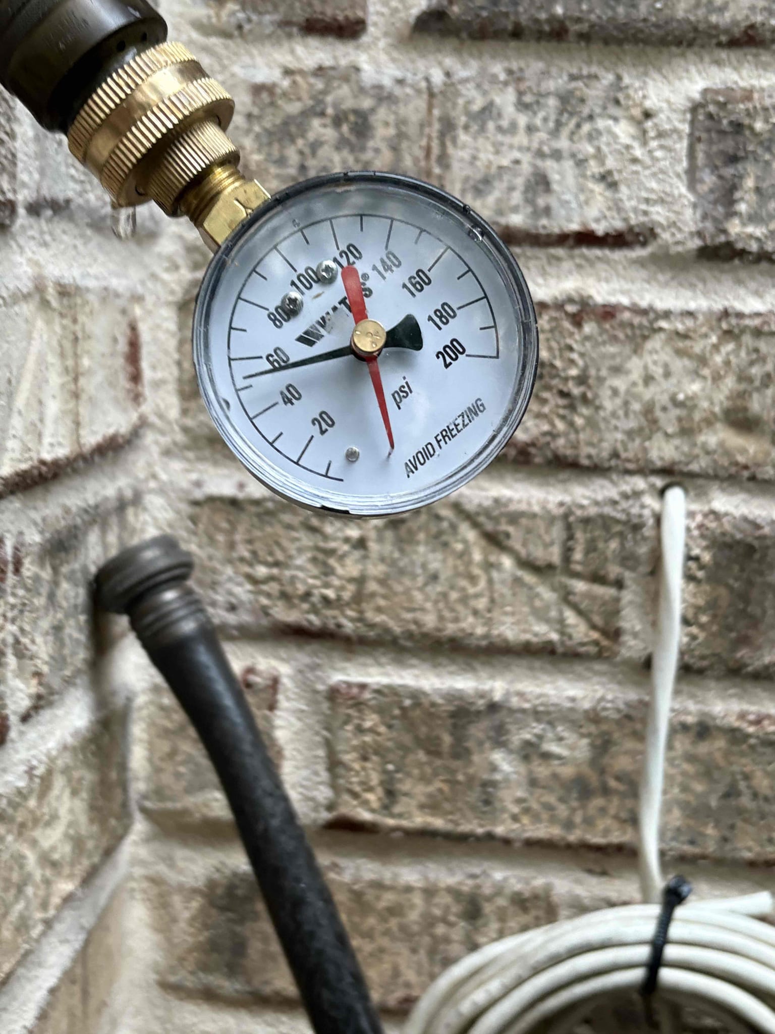 Client called us out due to one of the dual 50 gal nat gas water heaters leaking from a couple different places. The other heater was replaced in 2022. They were originally piped in series, which has one heater that does most of the work and the other is basically a storage tank. We replaced the failed heater with new Rheem pro series 50 gal nat gas water heater in a pan and up to code with properly supported 5 gal thermal expansion tank. We piped both water heaters in Parallel, which makes both water heaters take up an even amount of work. Added new check valve on cold feed added new tee for recirc line and new tee for expansion tank then our tee for the 2 water heaters, all in new copper pipe. Tied the hot side in as necessary with copper and fittings as well. Hooked the gas up and turned on to test. Both units are running as they should. 

We were out here in Feb. 2025 and replaced the failed pressure reducing valve. While doing my inspection I checked the water pressure and it was 