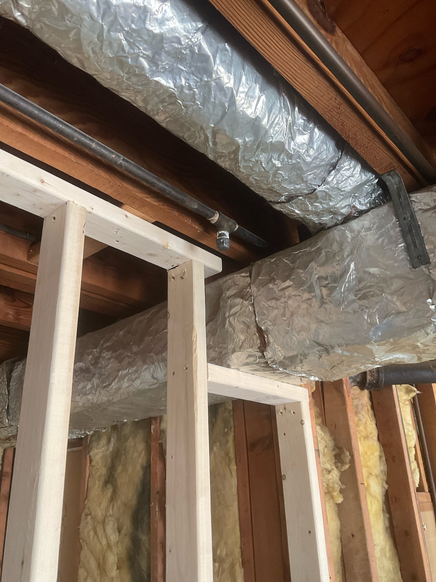 Relocate 1/2 “ black iron gas piping in garage , cap off a unused gas line 