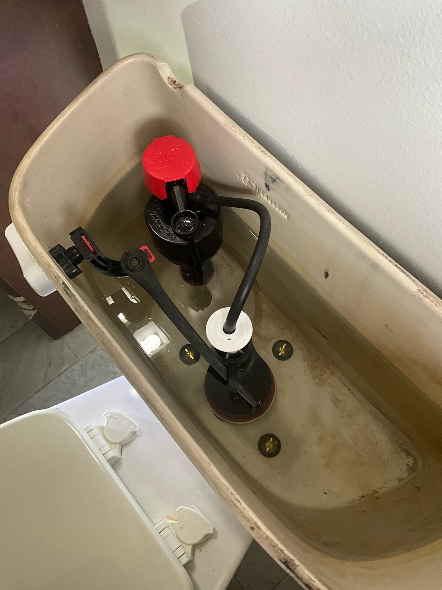 Customer had broken flush valve on existing Mansfield toilet. Customer had parts for Mansfield flush valve already. Replaced the flush valve (with customer supplied part), and then provided and installed fill valve, trip lever, supply line, and tank to bowl kit. Tested all work to ensure proper function and no leaks. None were found. Customer water pressure is at a safe level. Customer water heater is almost 30 years old. Replacement is strongly recommended due to age and condition. Left price for replacement. 