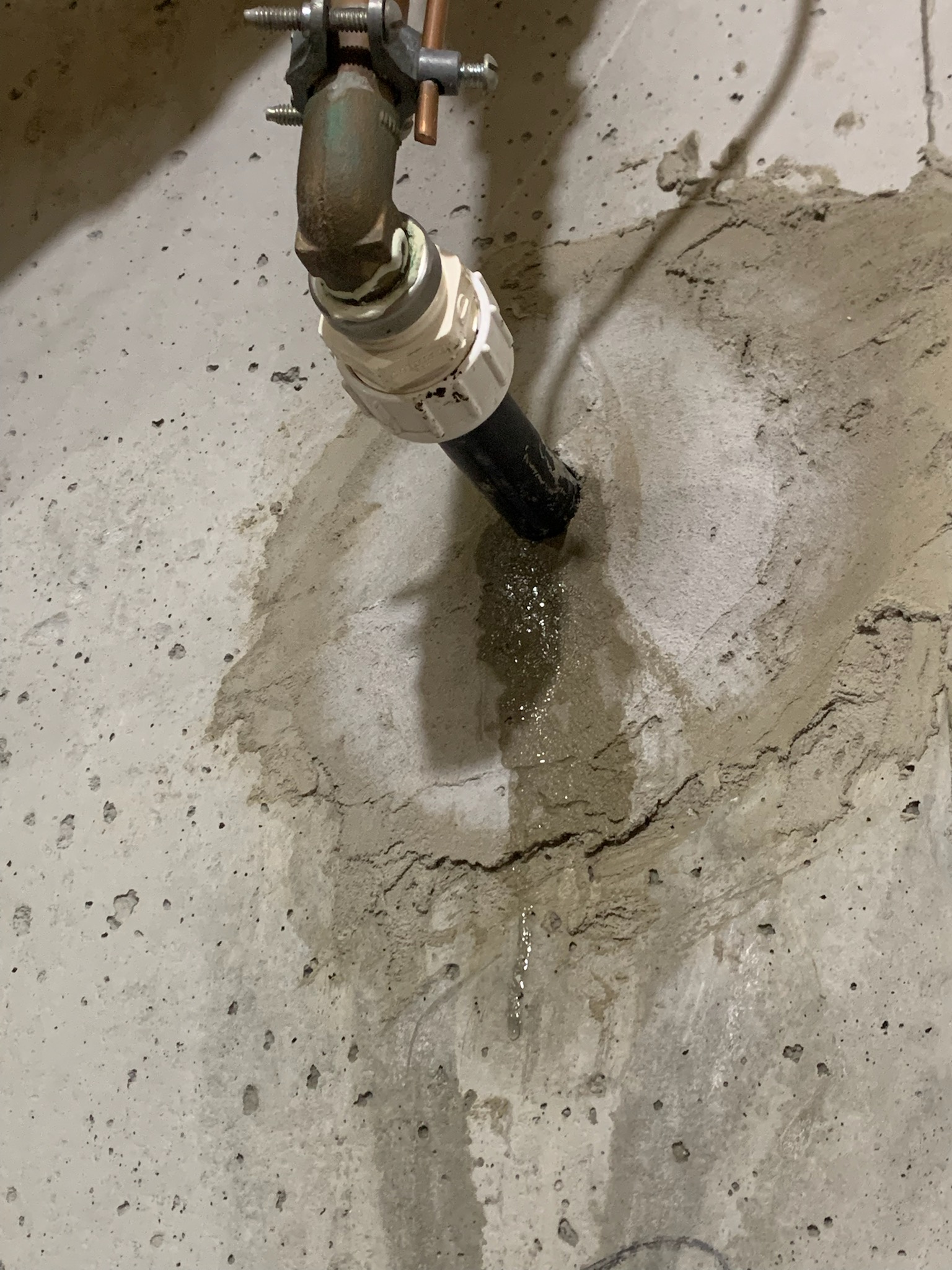 Black polybutylene water service had developed small leak on exterior of house due to the angle it was installed at. We cut out the pipe coming through the wall. Ran new copper pipe back through the wall and connected it to the existing lines bi5 inside and outside the house. Sealed both sides of the penetration with hydraulic cement, and spray foamed between the concrete. Pipe did have a PVC sleeve already going through the concrete. Tested to ensure a leak free installation. No further issue at this time. 1 year warranty on repaired section only. Thank you for choosing Chen plumbing. 