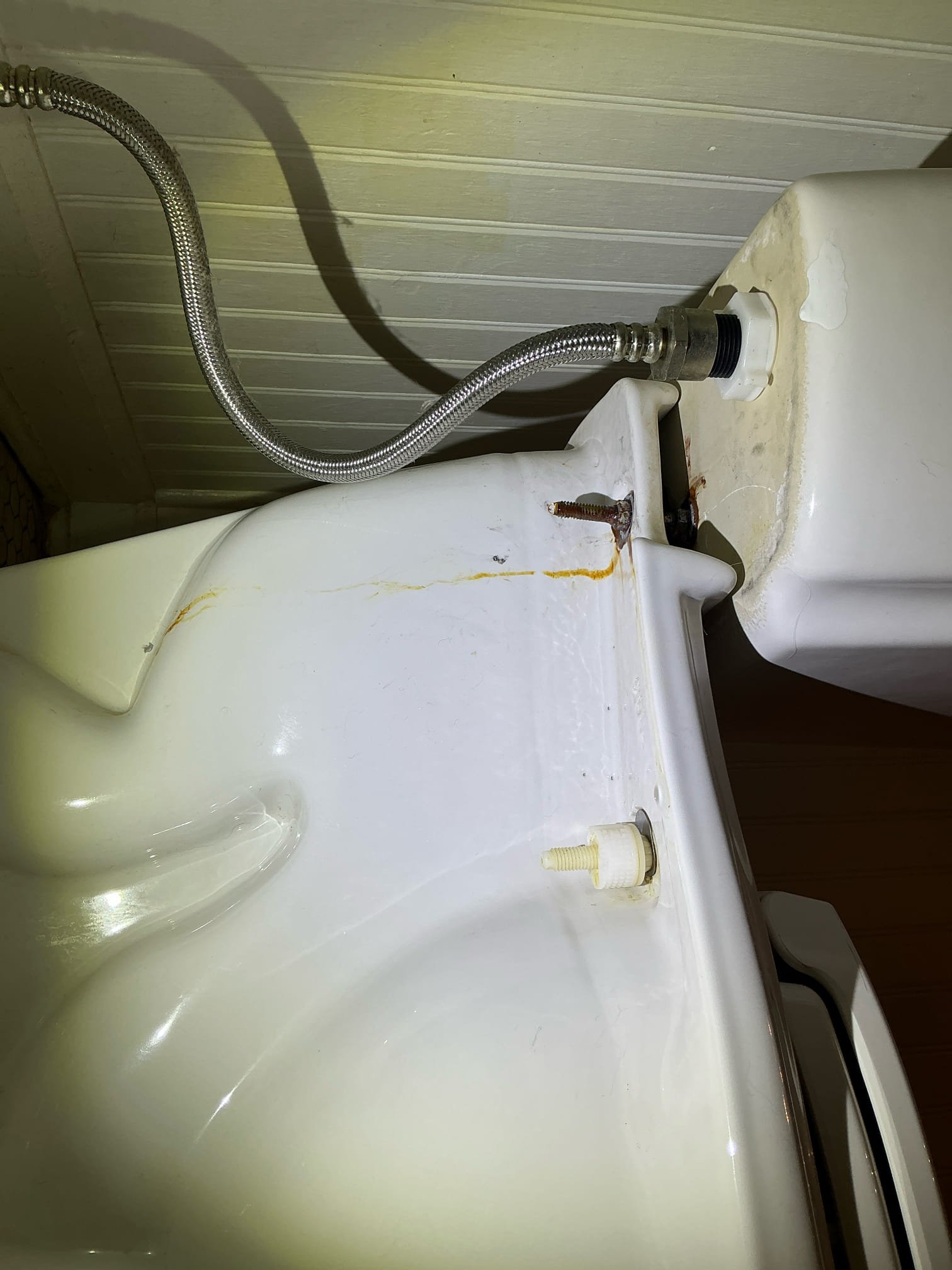 Client called us out due to their main floor bathroom toilet running intermittently and it was also leaking from a rusted tank to bowl bolt on left side. It was decided best to replace the old toilet. Installed customer supplied American standard 2 piece toilet in place of old and leaky one. Toilet flange was in good condition. Sat down new wax ring and closet bolts, the sat the new toilet. Fastened it down, shimmed it, tested for leaks, then caulked around the base leaving back 1/3 open for water to escape if it leaks. 

Advised client give til tomorrow to use for caulking to set. 

1 yr labor warranty