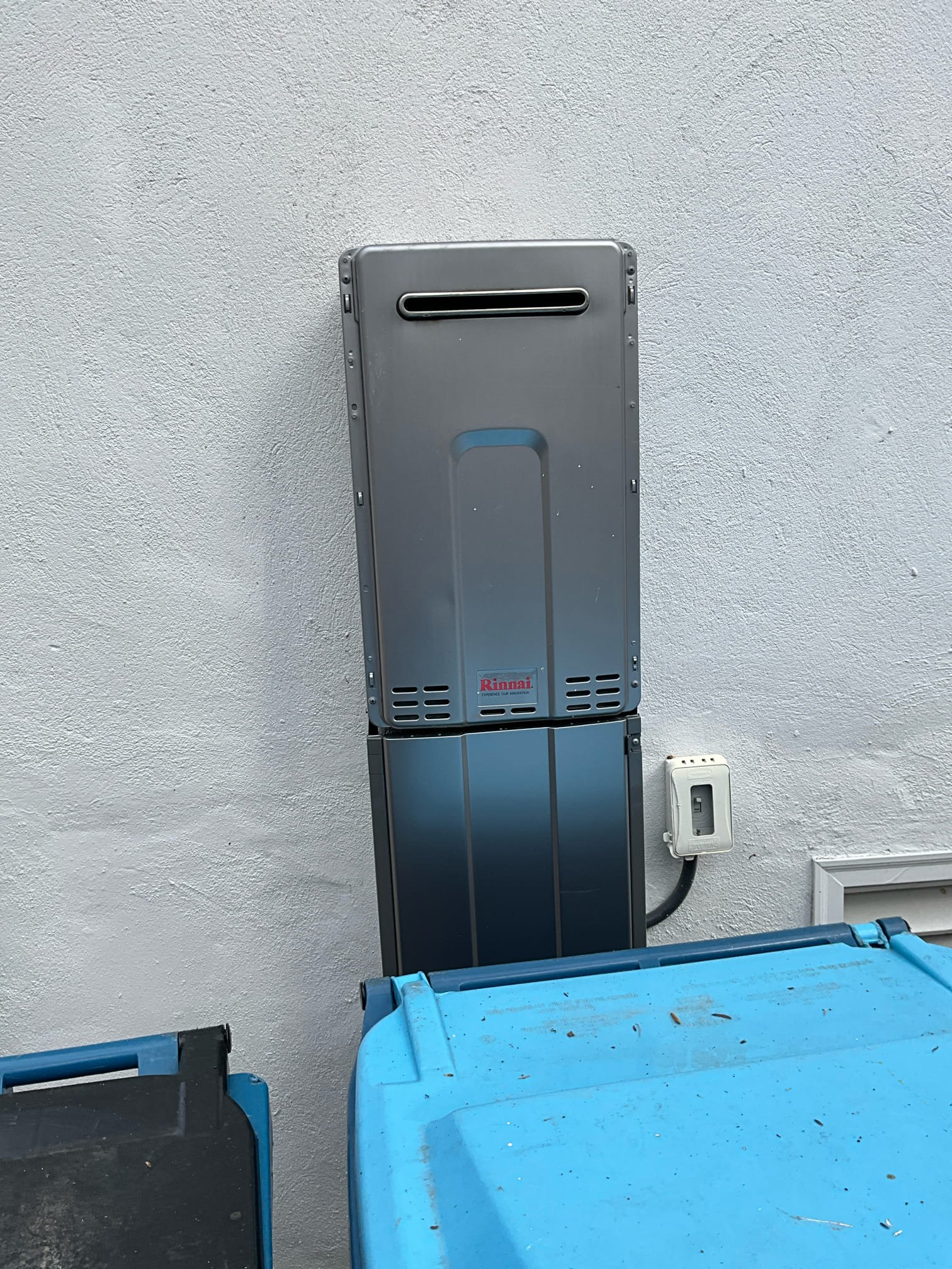 Call for loose toilet after recent work, and a shower system replacement.

Arrived and inspected all requested items. This included the powder room toilet being loose. This was resolved by reapplying the adhesive sealant. It appears as if toilet was moved slightly prior to complete adhesive cure. Toilet is not moving by the time I left the job site. 

Shower system was a panel style system of unknown brand. A new system was present on site. The complaint for the old system was that it had very low pressure, it took a very long time to get hot water, and the electrical components were not functioning. I removed old unit and found supply lines protruding 5rough a small hole in the tile. Tile was broken in several places behind the unit, likely during this systems installation. I had to turn water off to the home during this work because shut off valves were inaccessible inside the wall.
Due to the nature of these panel systems, I went through all connections inside the panel with water o