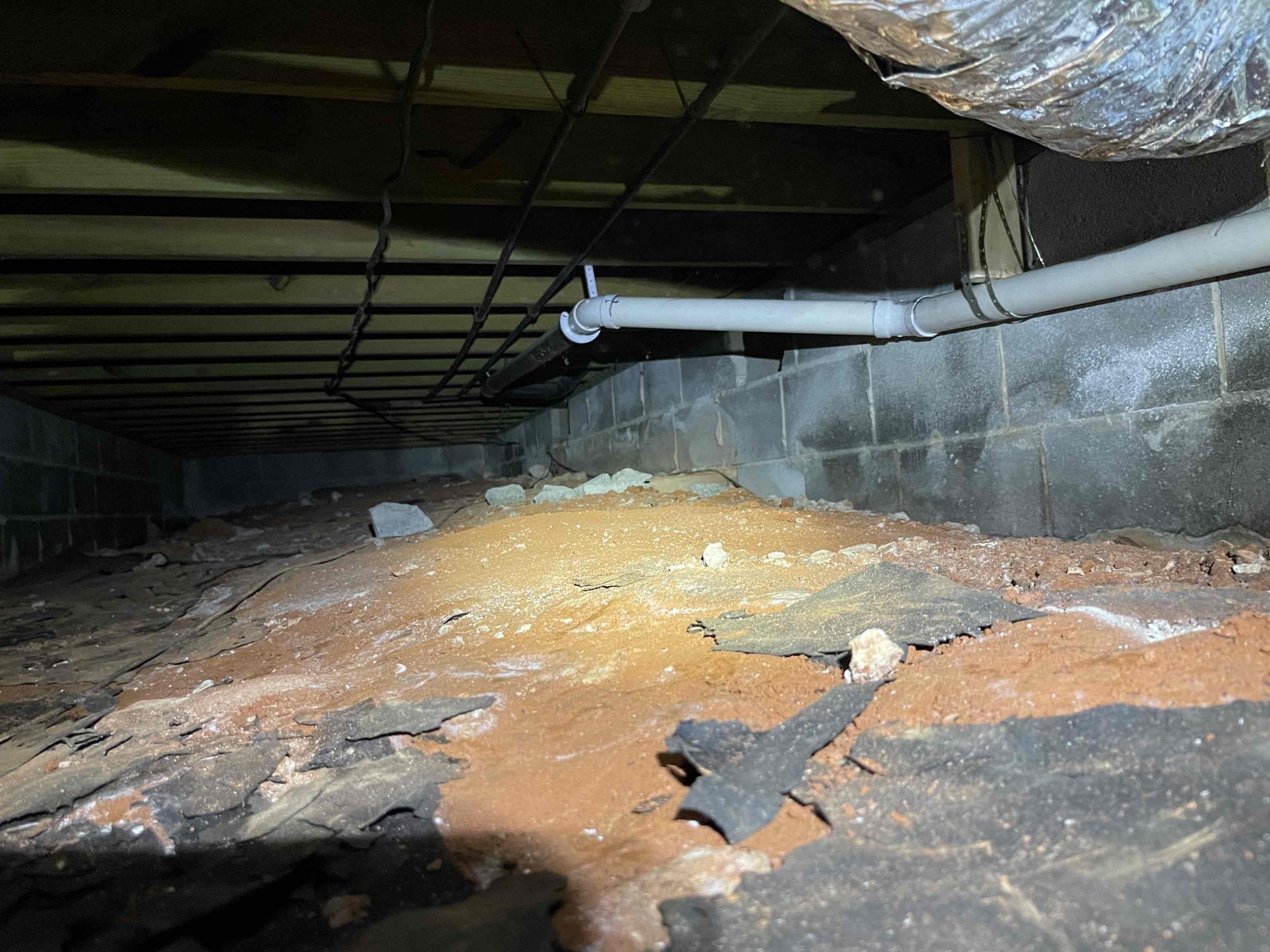 Cut out back pitched kitchen/laundry drain. Added new tie in to the mainline, and rerouted two separate lines. One going to the kitchen sink, one going to the washing machine. Verified proper pitch along both runs. Secured piping with 2x4’s. Ran water through both fixtures to ensure a leak free installation. No further issue at this time. 2 year warranty on replaced sections. Thank you for choosing Chen Plumbing!