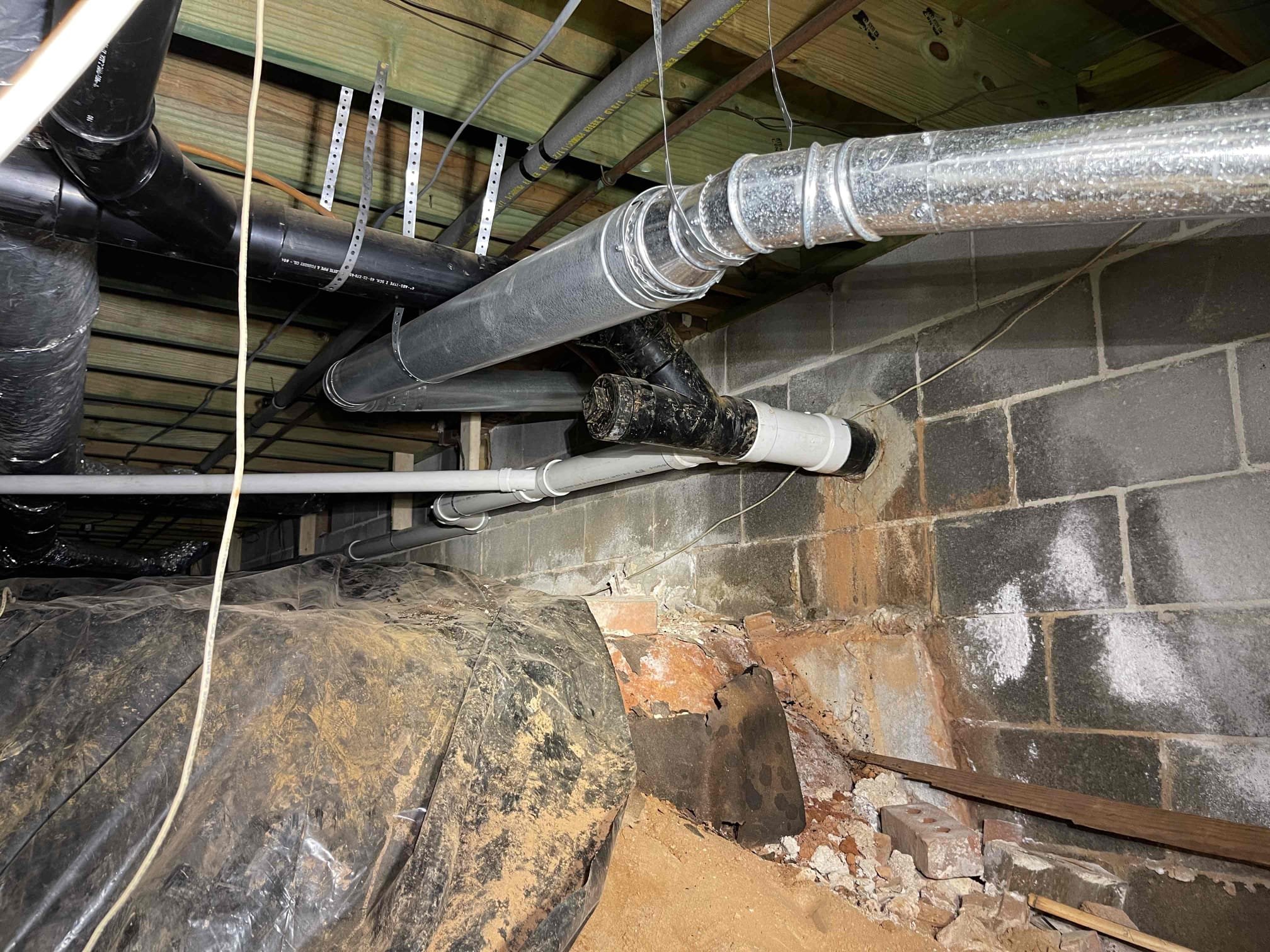 Cut out back pitched kitchen/laundry drain. Added new tie in to the mainline, and rerouted two separate lines. One going to the kitchen sink, one going to the washing machine. Verified proper pitch along both runs. Secured piping with 2x4’s. Ran water through both fixtures to ensure a leak free installation. No further issue at this time. 2 year warranty on replaced sections. Thank you for choosing Chen Plumbing!