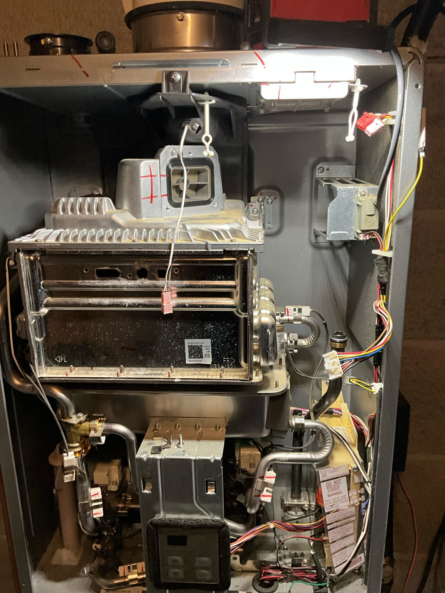 Return to install ordered Rinnai exhaust assembly.

Removed old assembly, installed new part. Replaced gaskets in gas conversion chamber. While on site I also flushed the water heater. The flush resulted in SIGNIFICANT amounts of sediment removal. 

Tested hot water at tap, cleared line of residual air.



