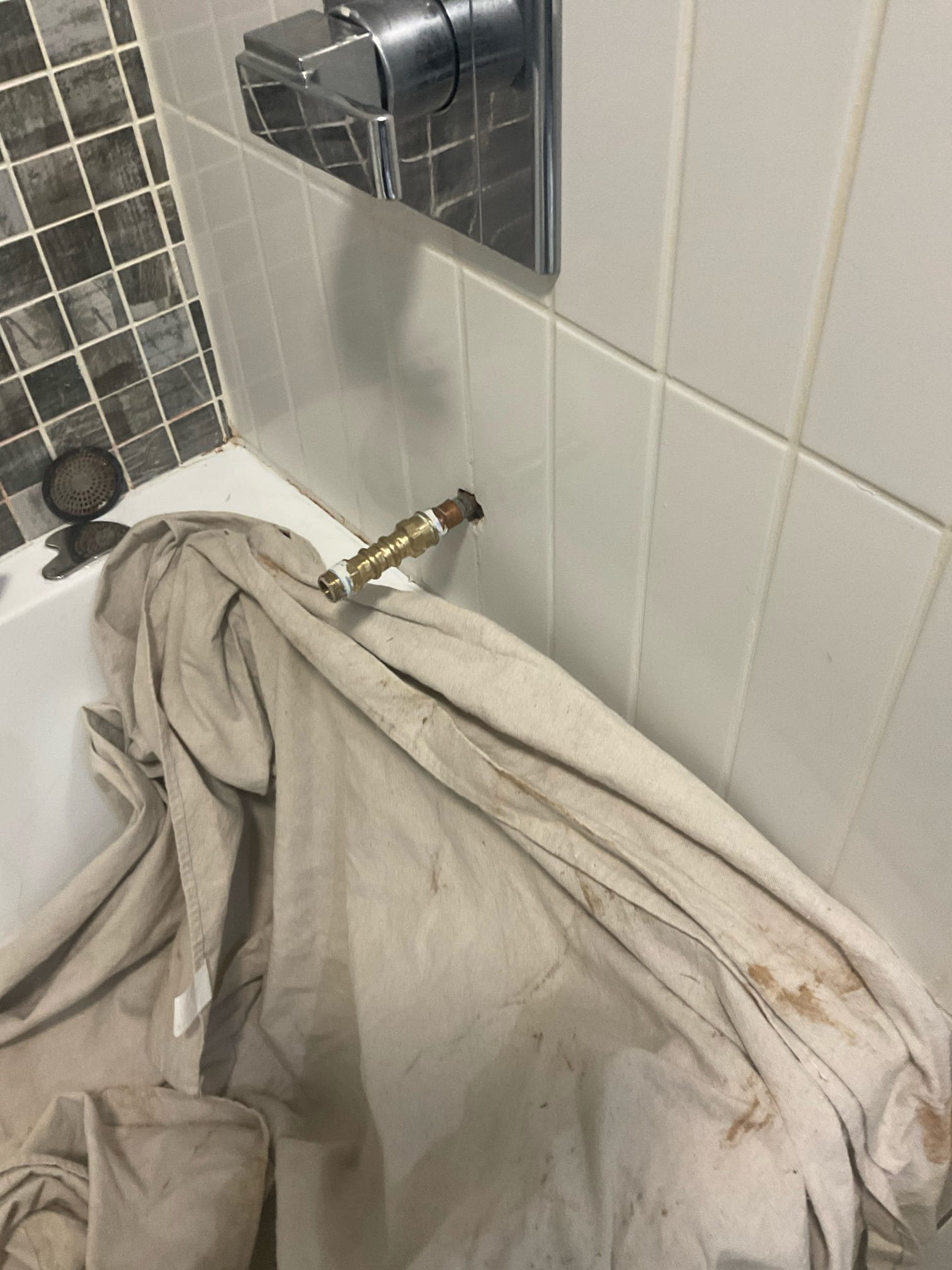 Installed customer supplied tub spout 