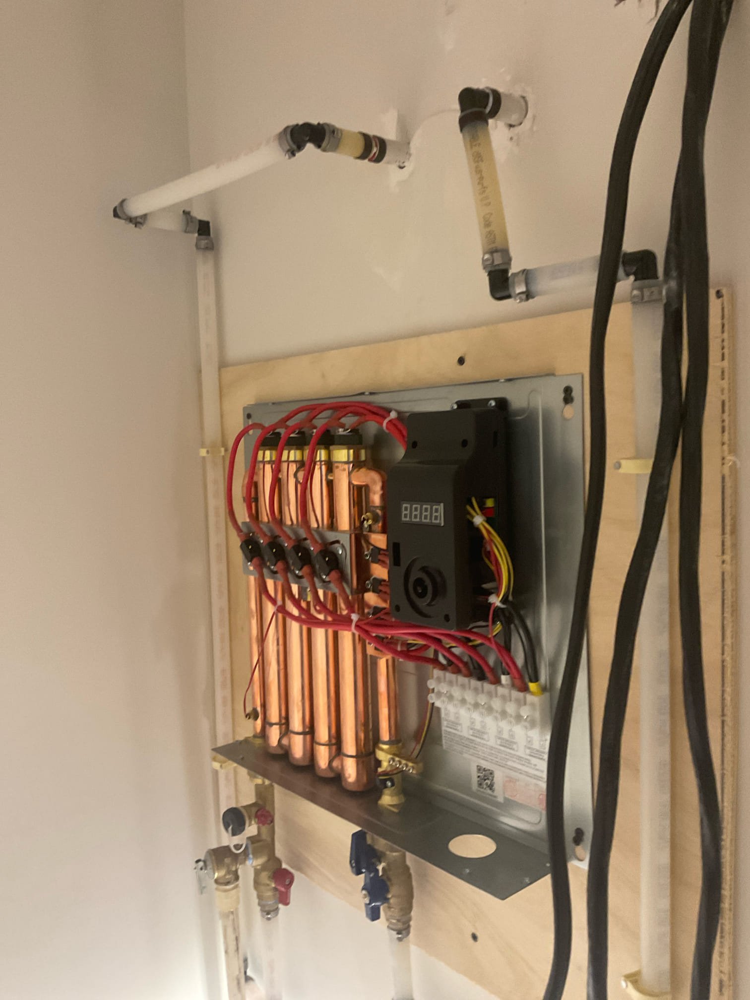 Replaced a tank water heater with electric tankless customer supplied 