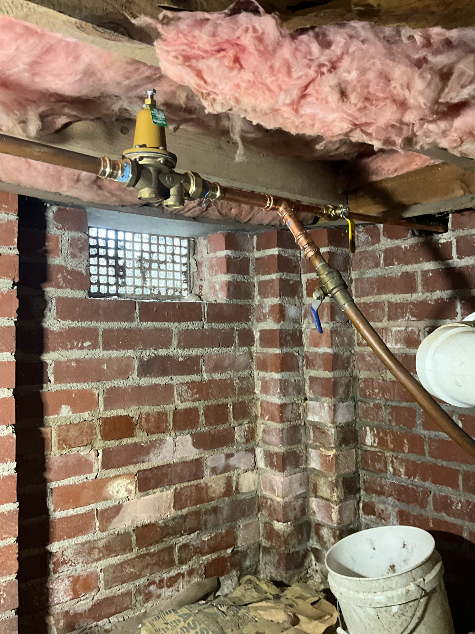 Return to install water heater and replace pressure regulating valve.

Removed old water heater. In order to remove unit, we removed small quarter inch trim pieces of both sides and the bottom of access doorway. I removed door, and reinstalled door after the work. 

New water heater was installed. Expansion tank and mounting bracket installed. New shit off valve. Removed excessive fittings and removed tension from pipes. Re routed t&p line. Installed drip pan under unit. Secured vent with screws instead of just tape.

Removed pressure regulating valve and replaced with new valve. Lao remove all remaining galvanized piping from this section. Installed new hose Bibb, including dedicated shut off valve. Silicone applied to surrounding of hose spigot.

When pressurizing I did notice some crossover occur in, which was a complaint previously. Charlie expressed nothin*that is consistent with hot water crossing when pressurized, and expressed this as a low priority as it was not causing hot wa